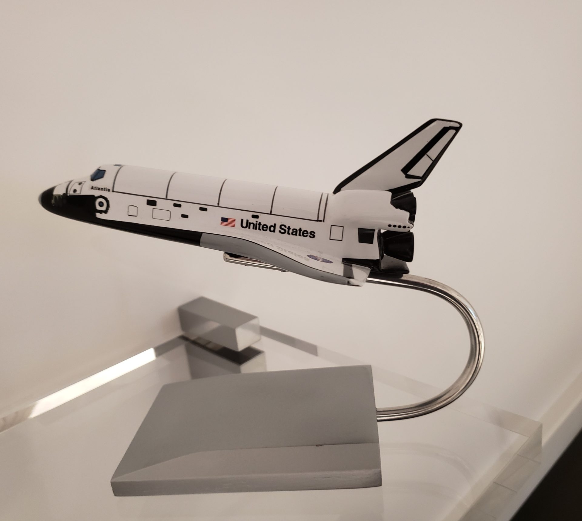 a model of a space shuttle on a stand
