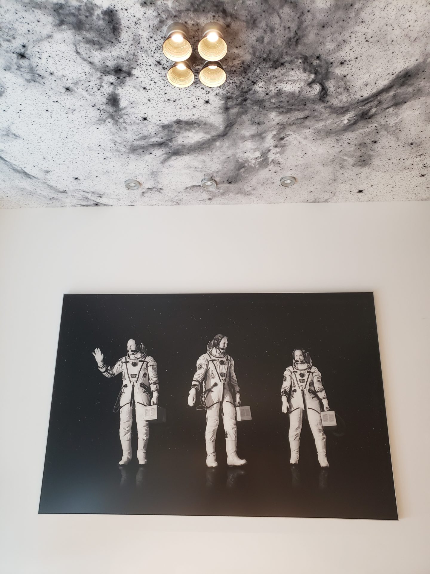 a picture of astronauts on a wall