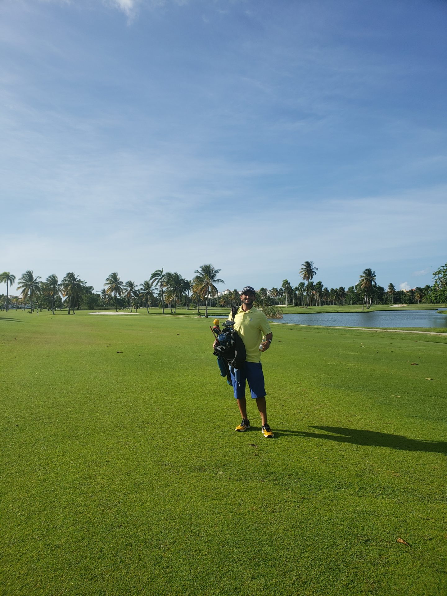 a man standing on a golf course