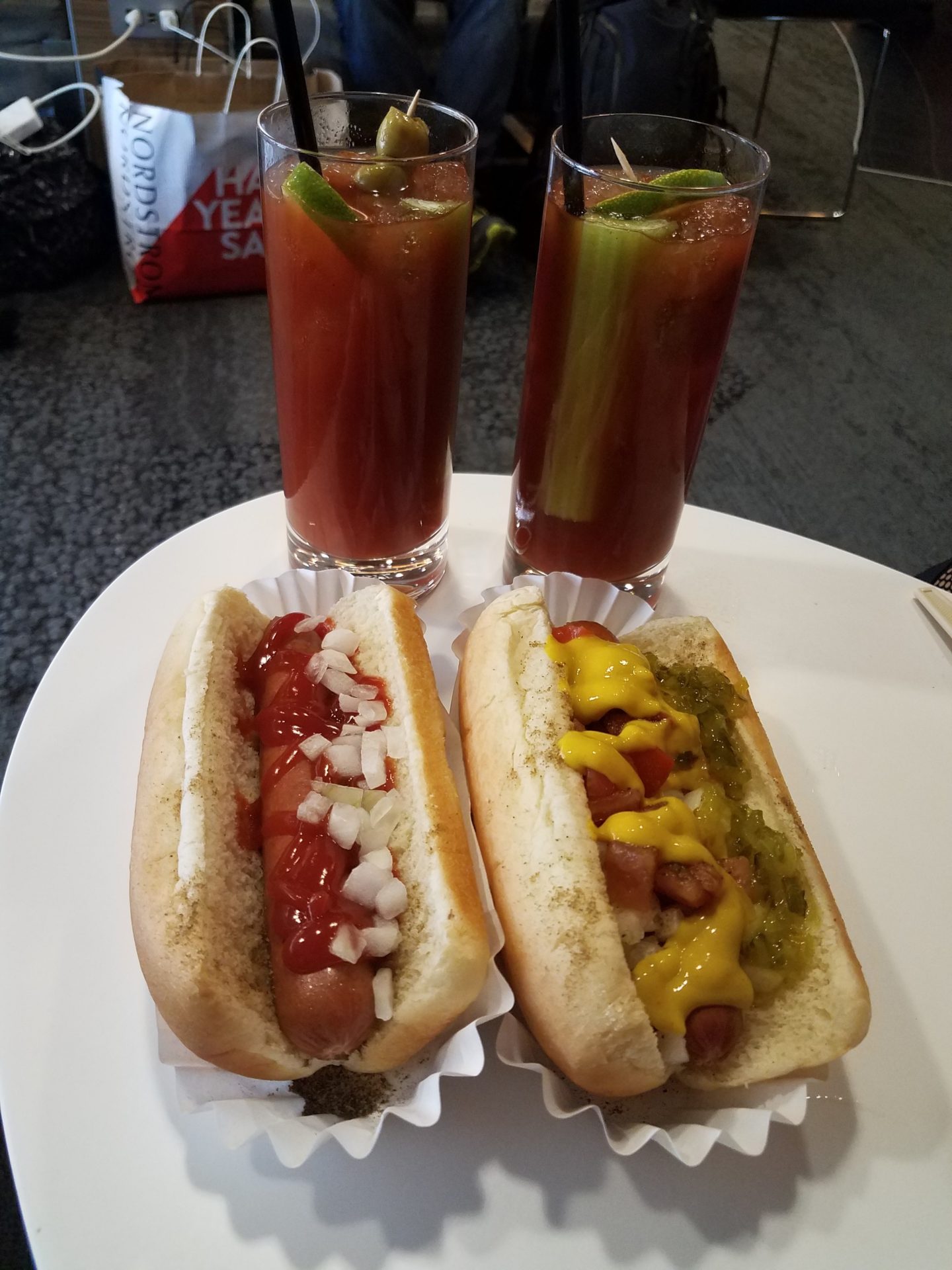 a plate of hot dogs and drinks