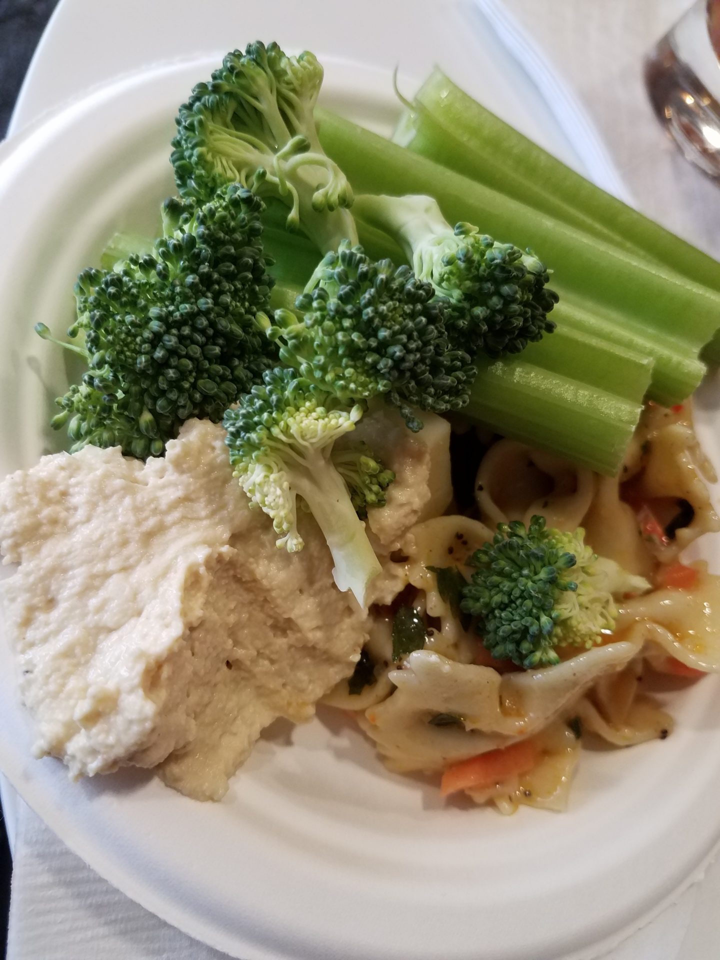 a plate of food with broccoli and pasta