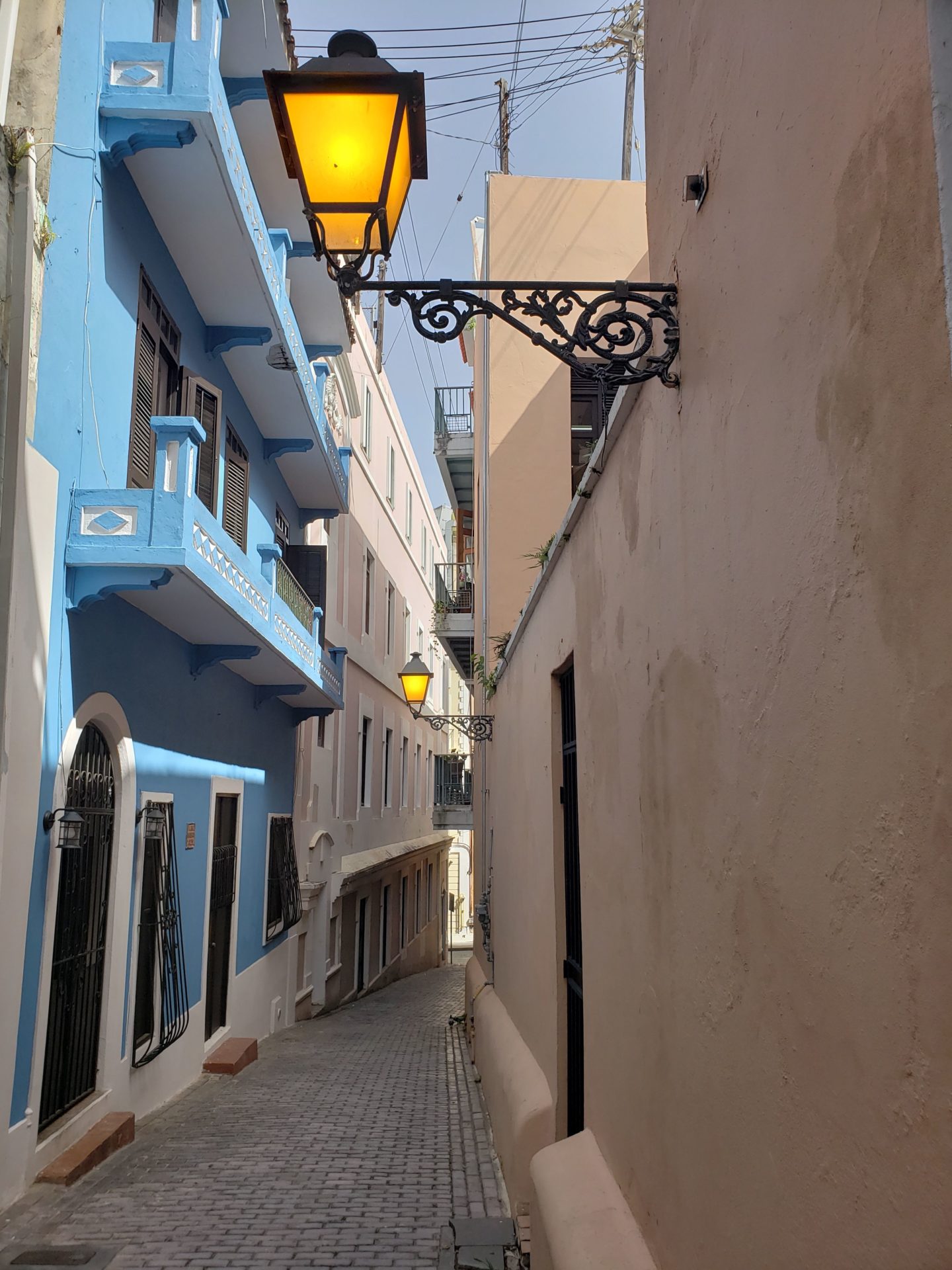 a street light in a narrow alleyway