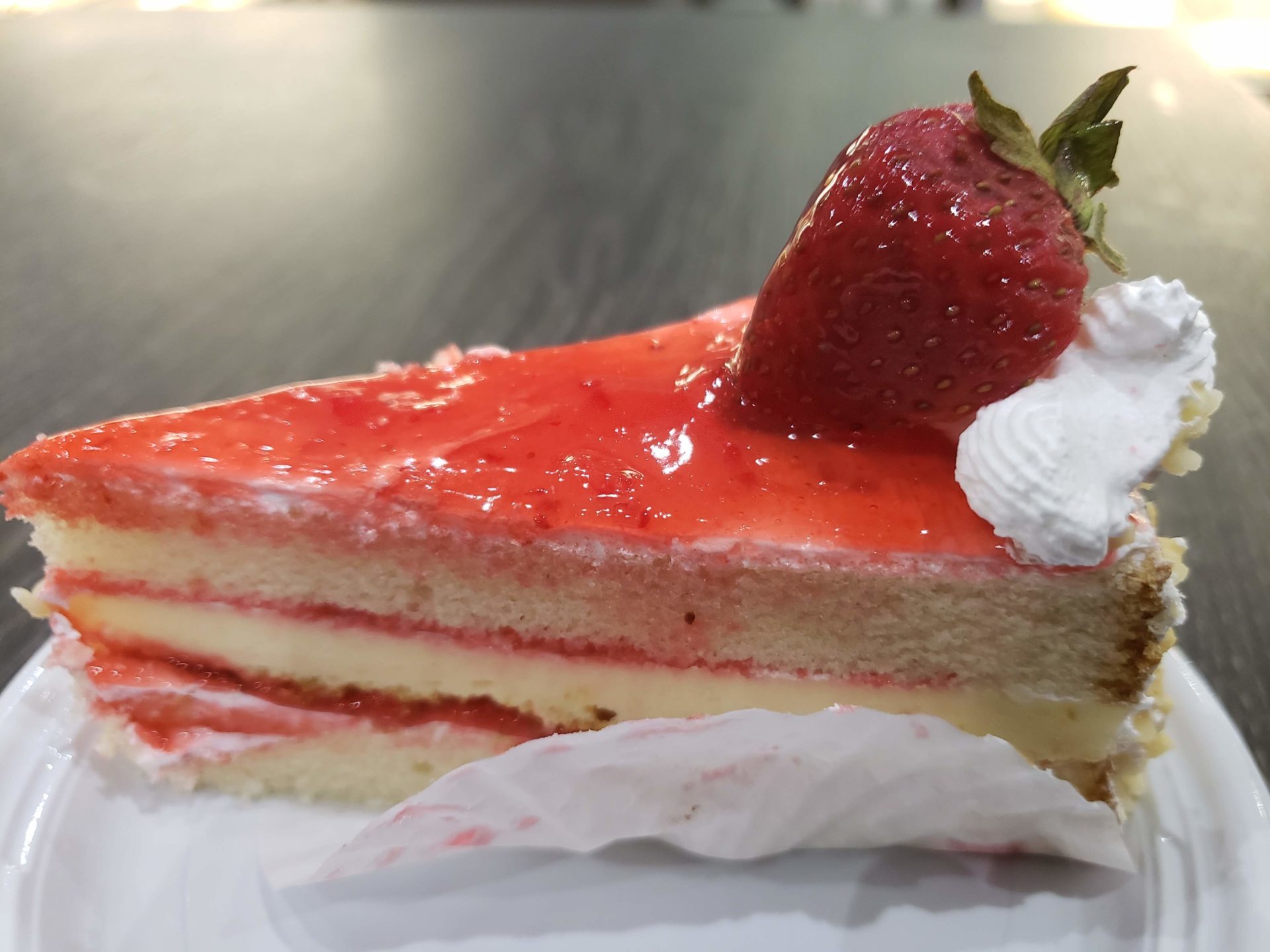 a slice of cake with a strawberry on top