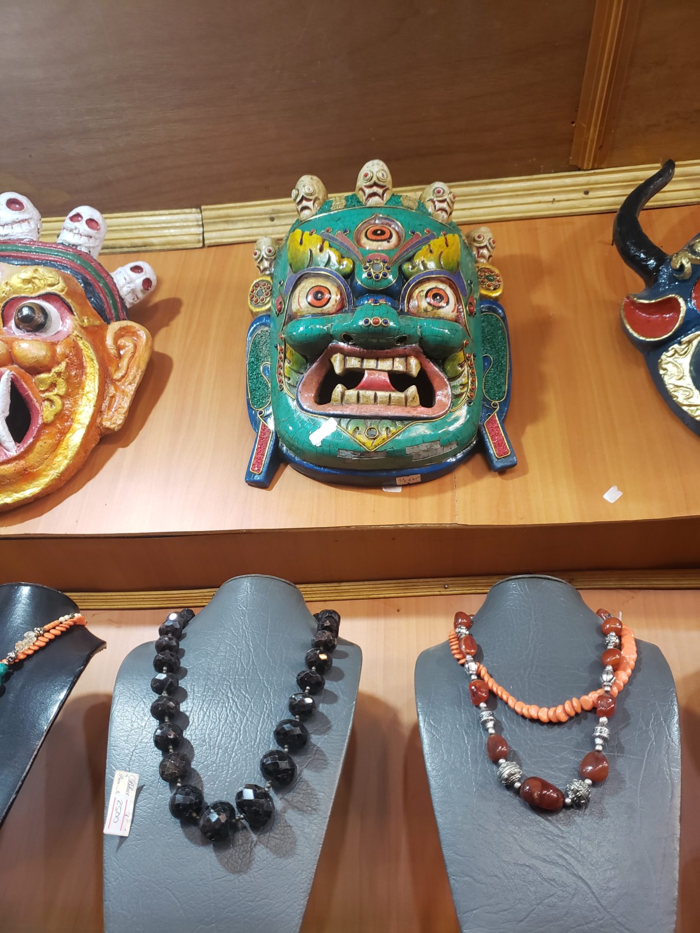 a group of masks on a shelf