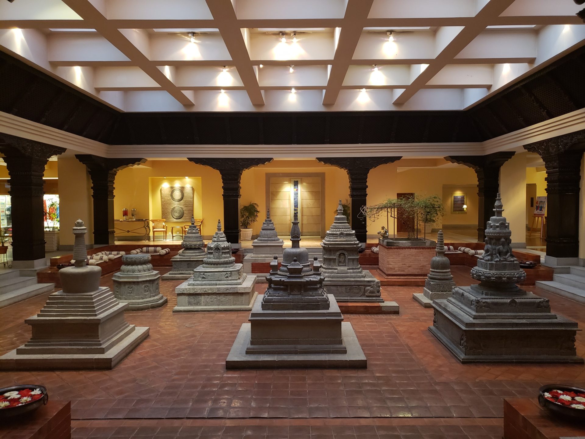a large room with many small statues