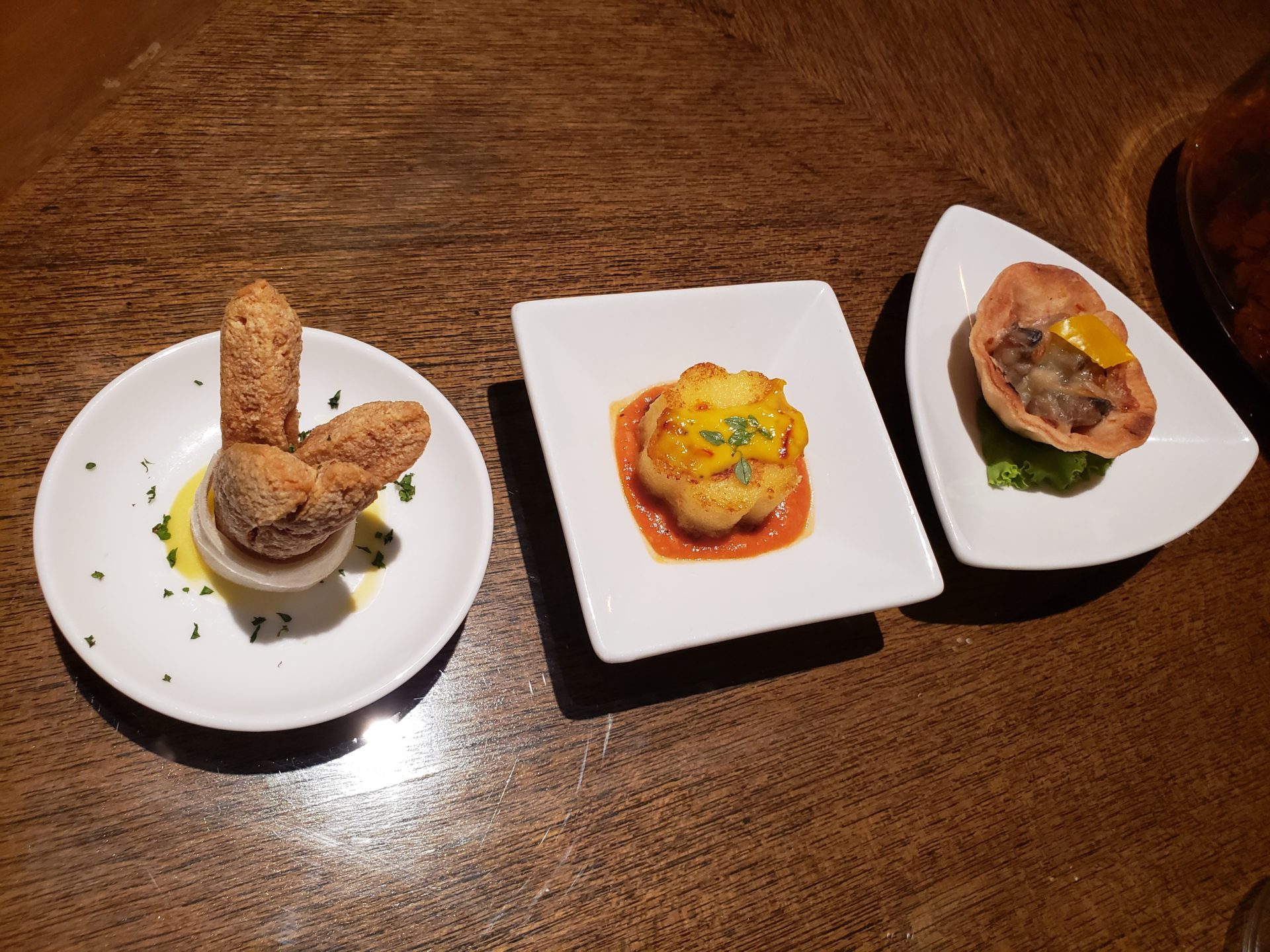 a group of small plates with food on them