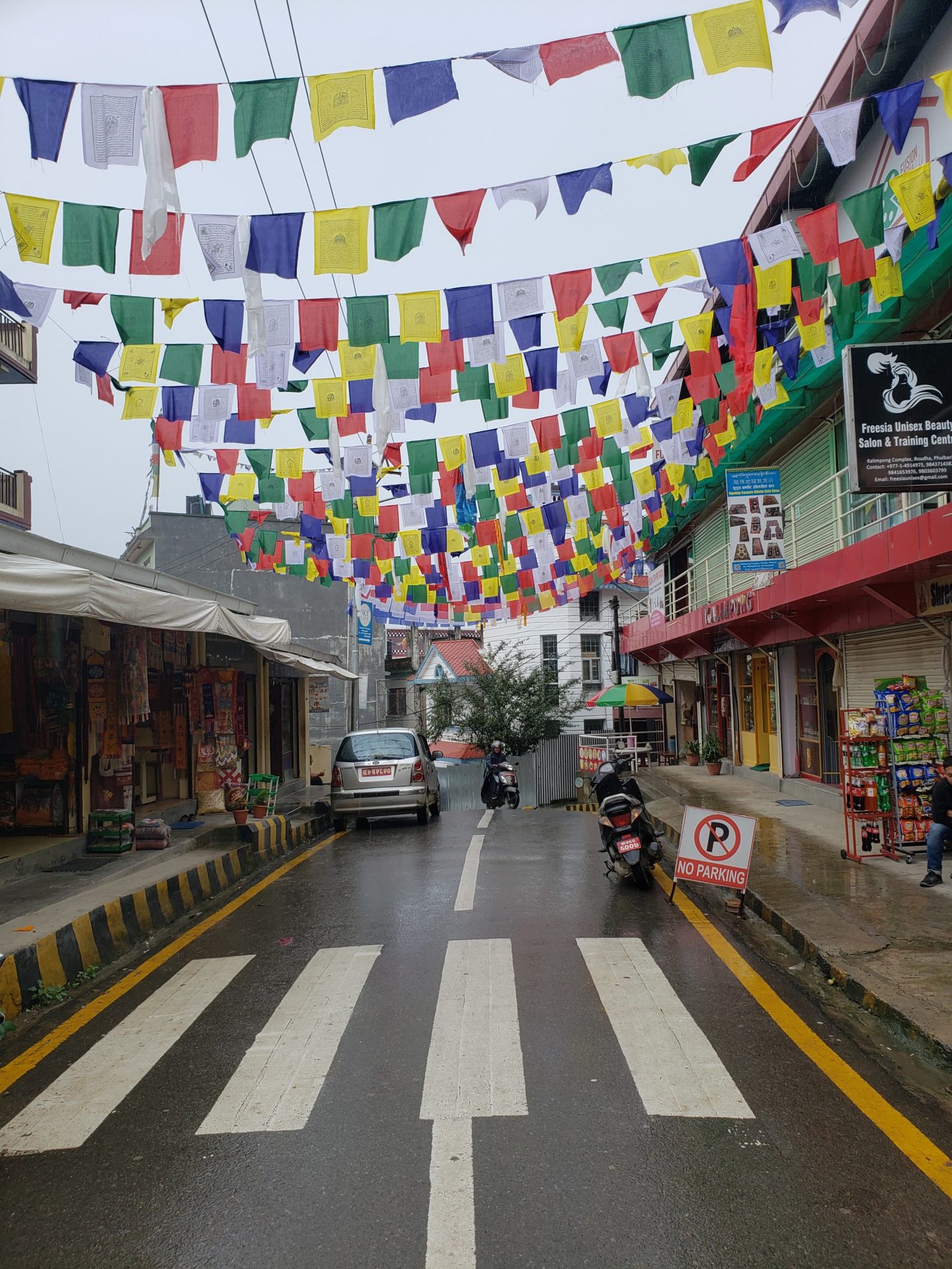 a street with colorful flags over it