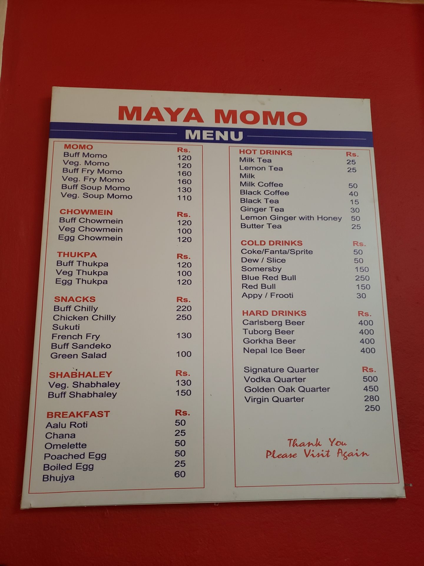 a menu on a red surface