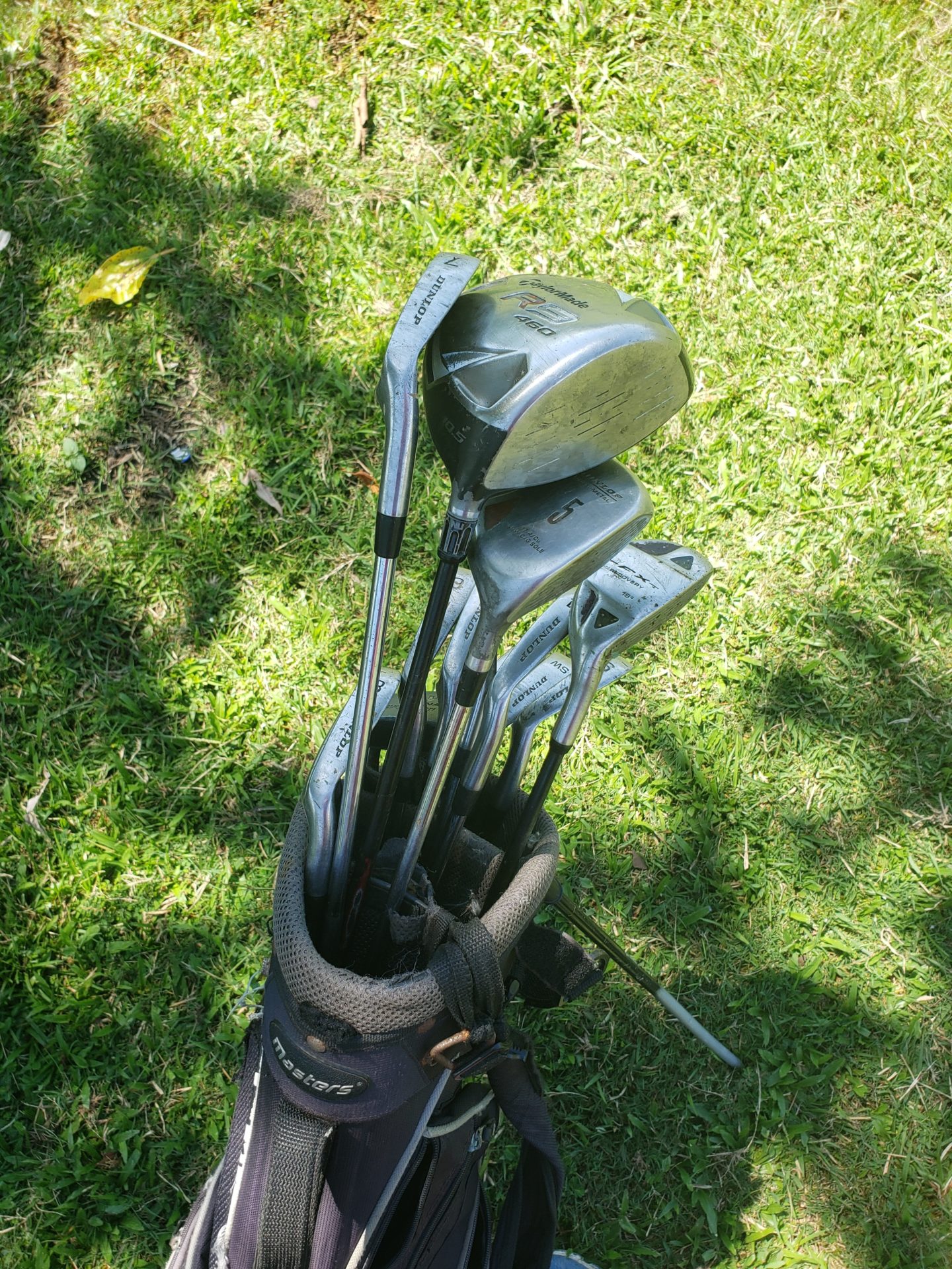 a group of golf clubs in a bag