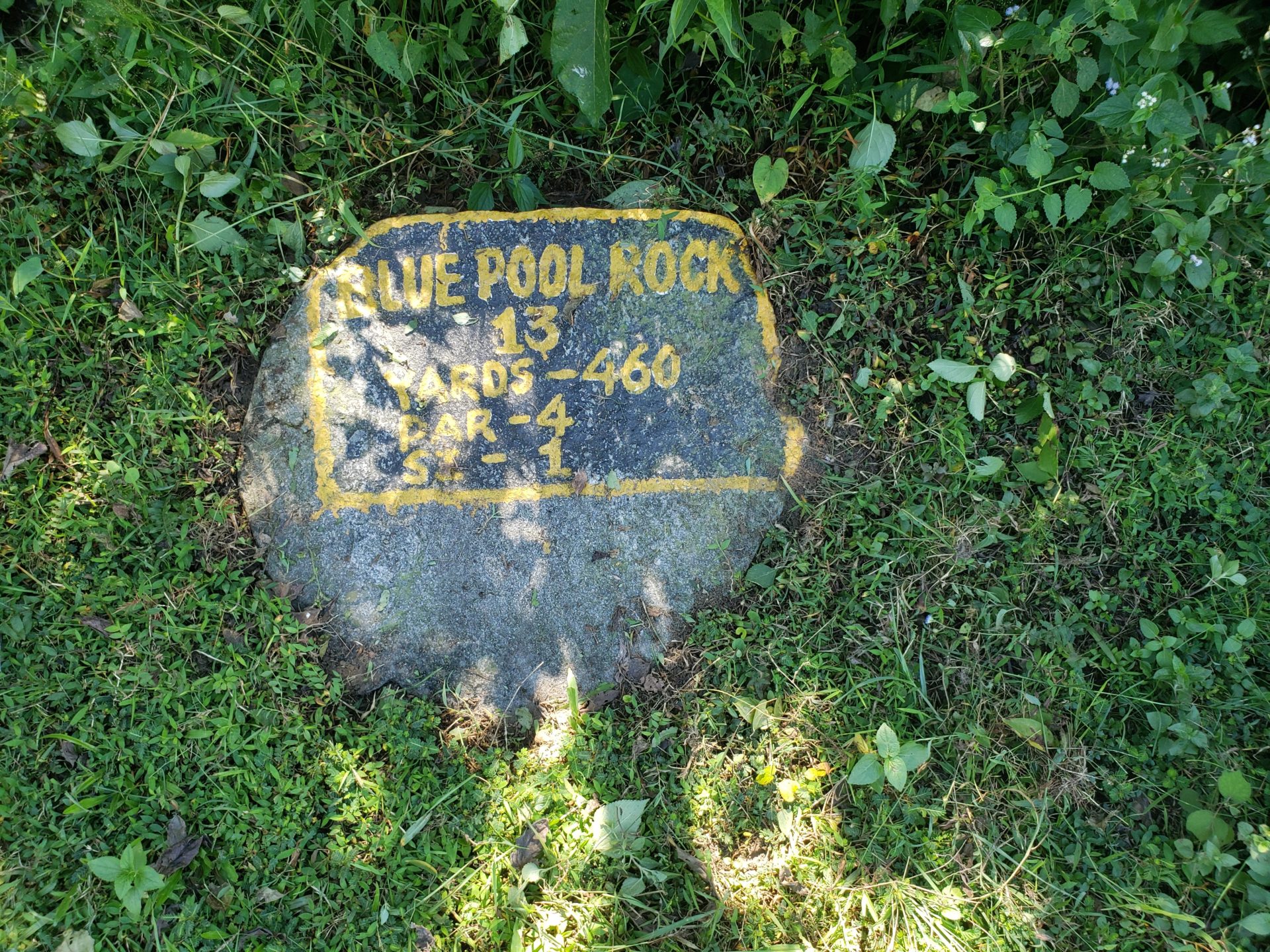 a rock with a yellow text on it