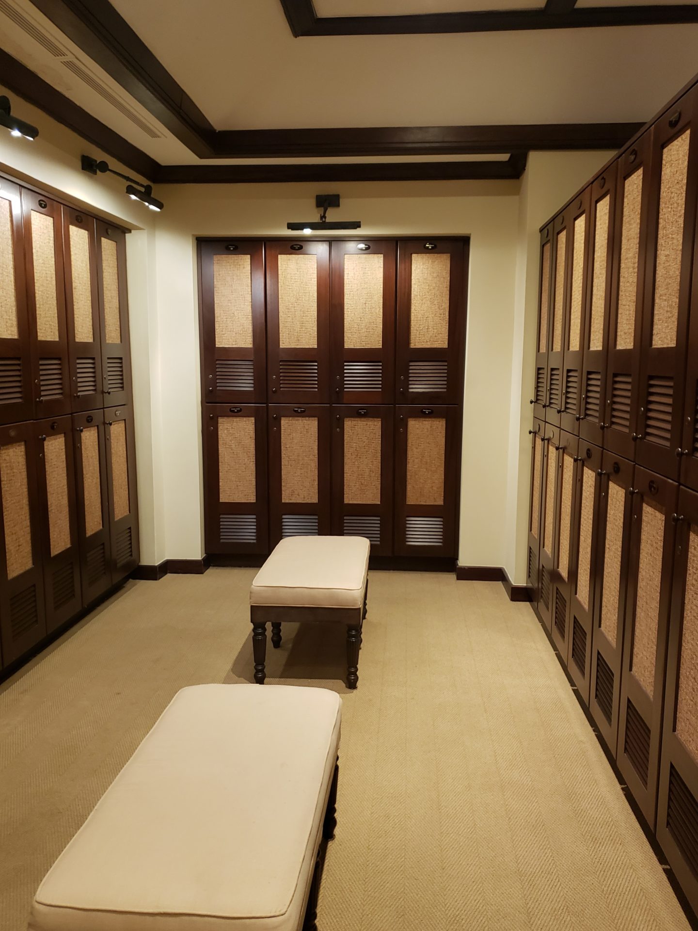 a room with a bench and lockers