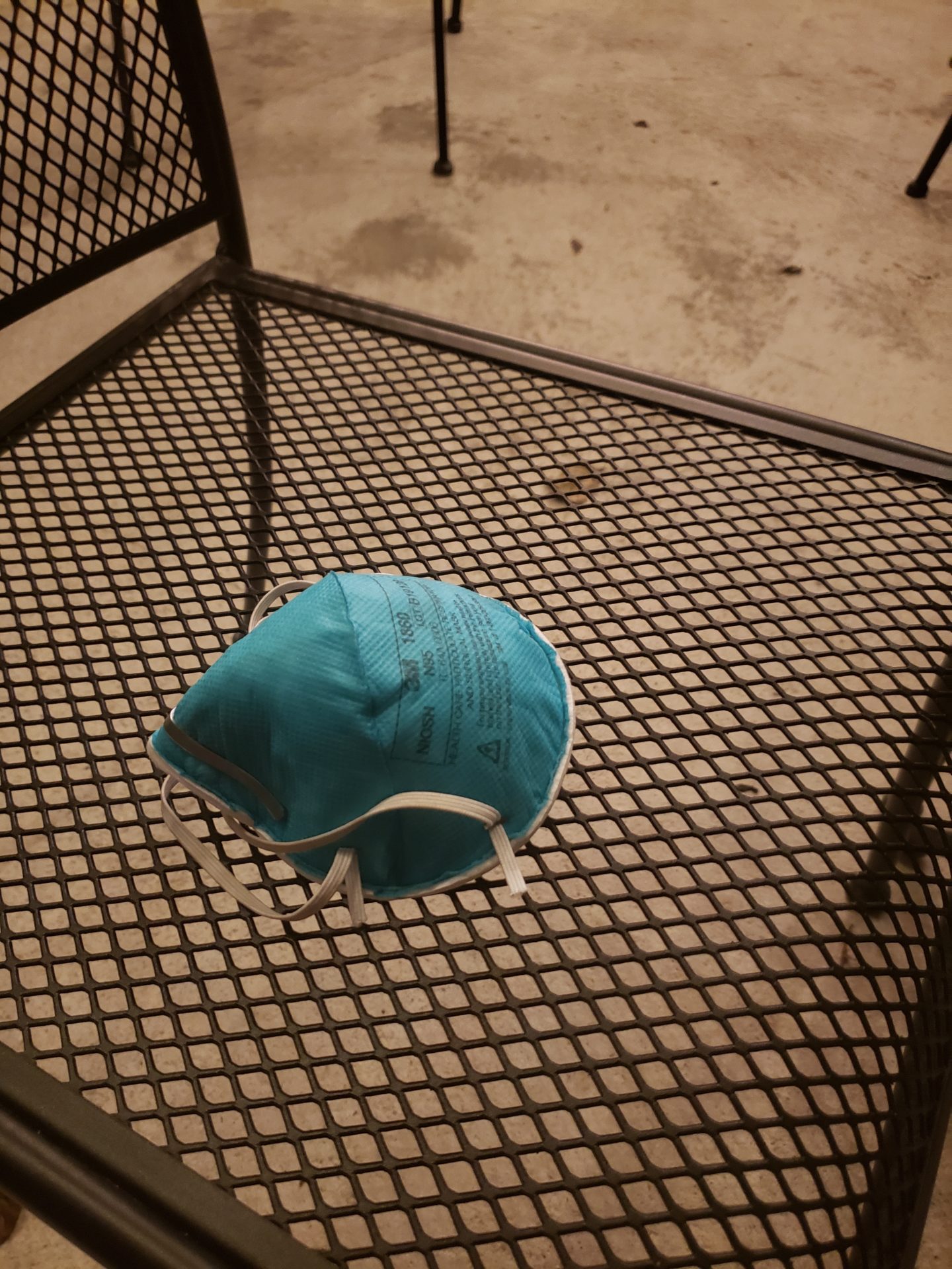 a blue face mask on a table