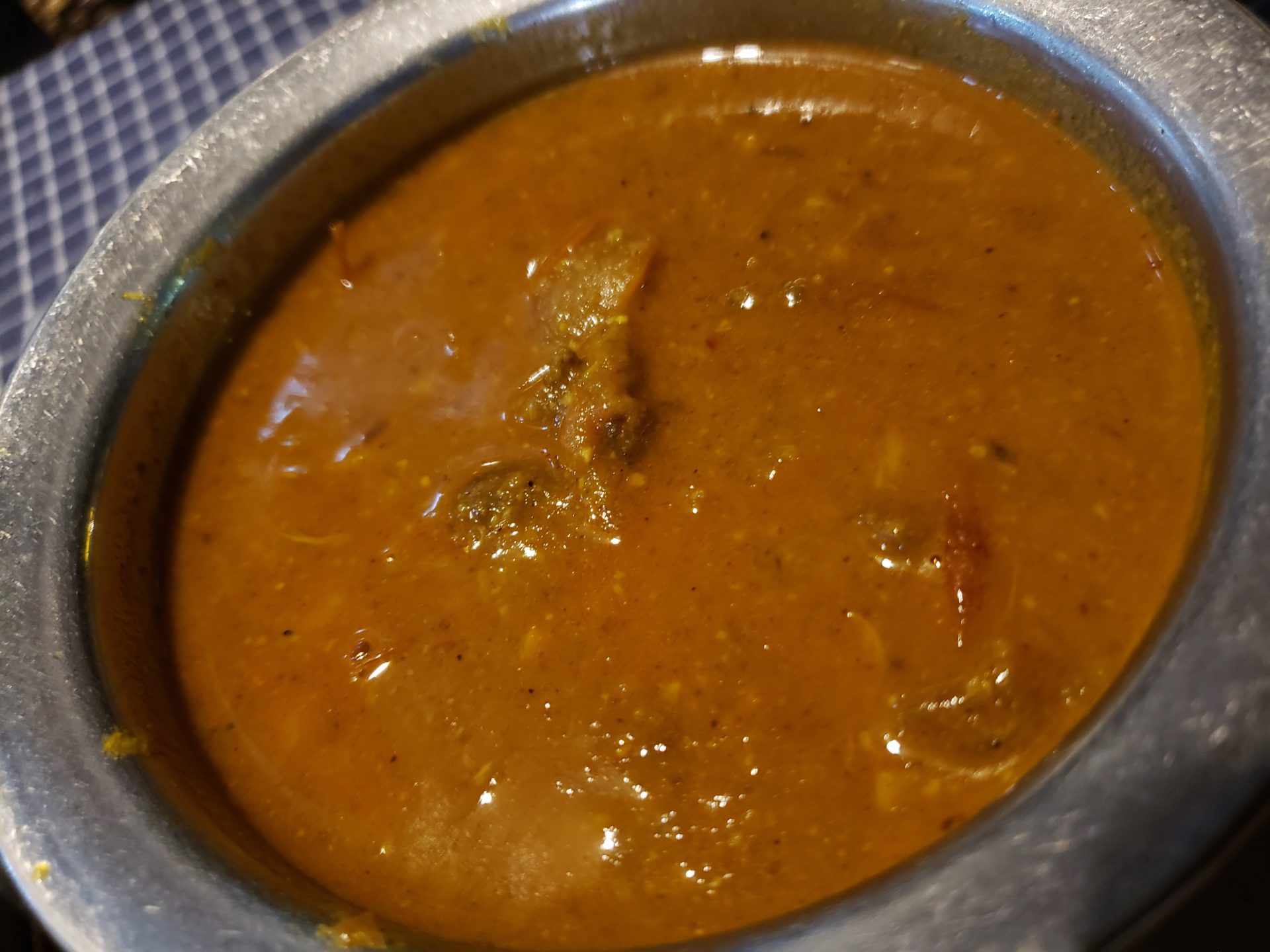 a bowl of brown soup