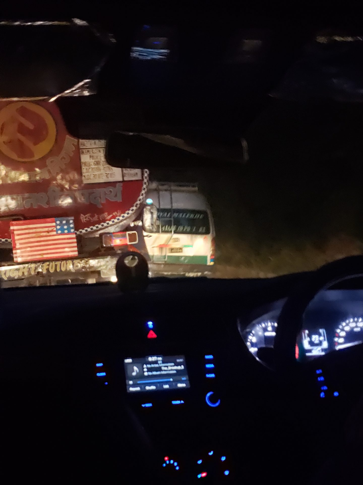 a view from the front of a car at night