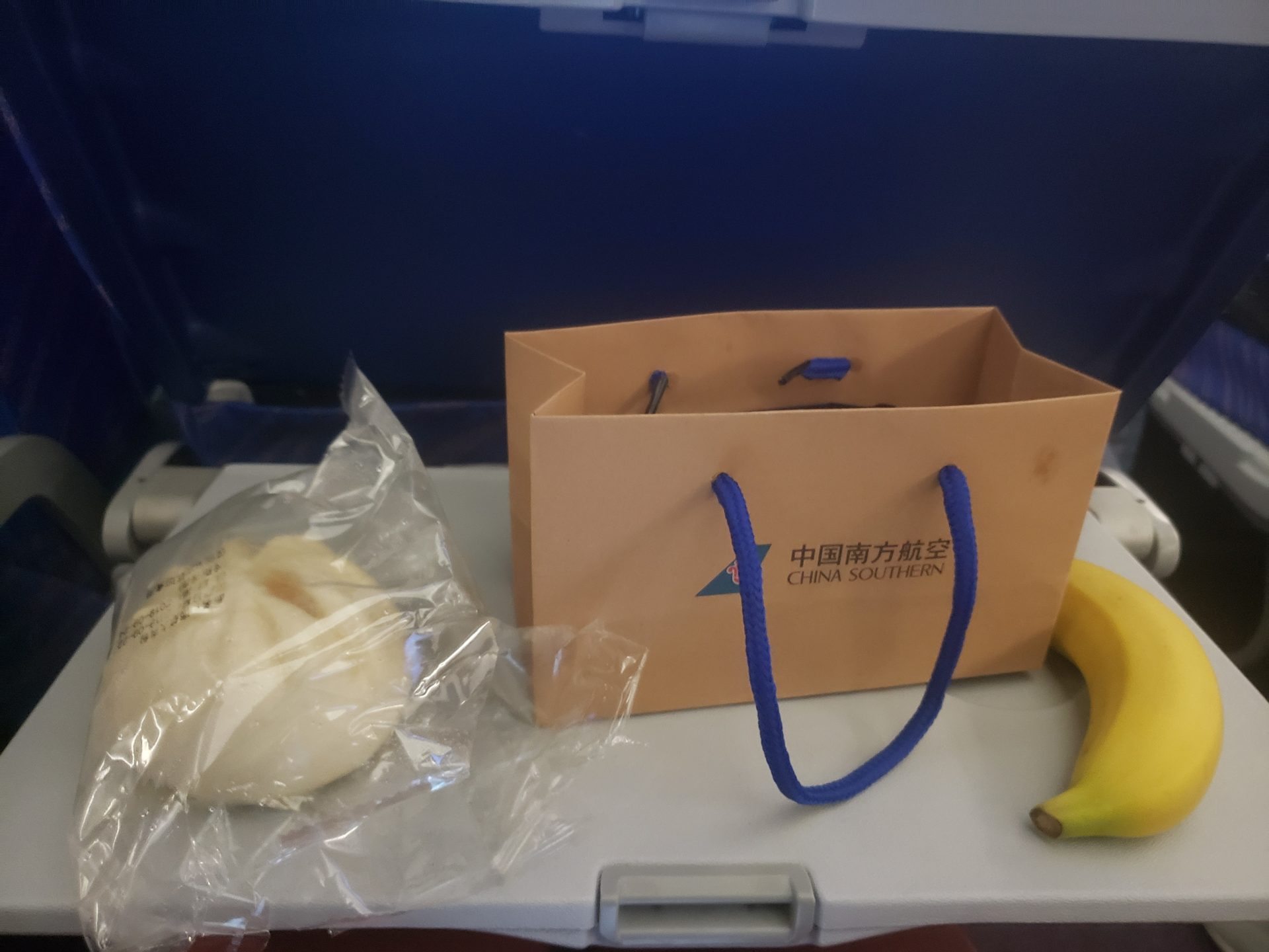 a bag and banana on a table