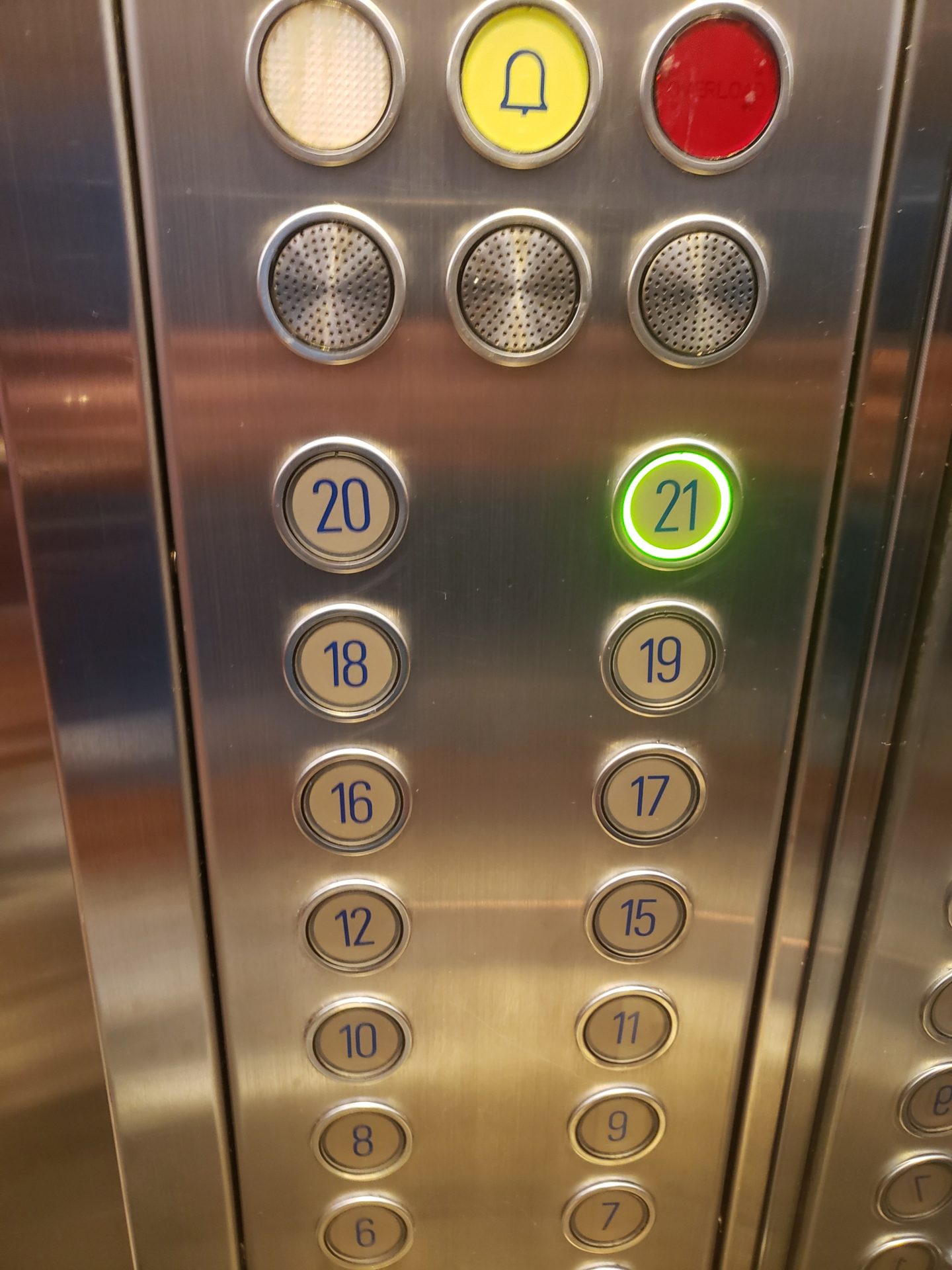 a close up of buttons on a elevator