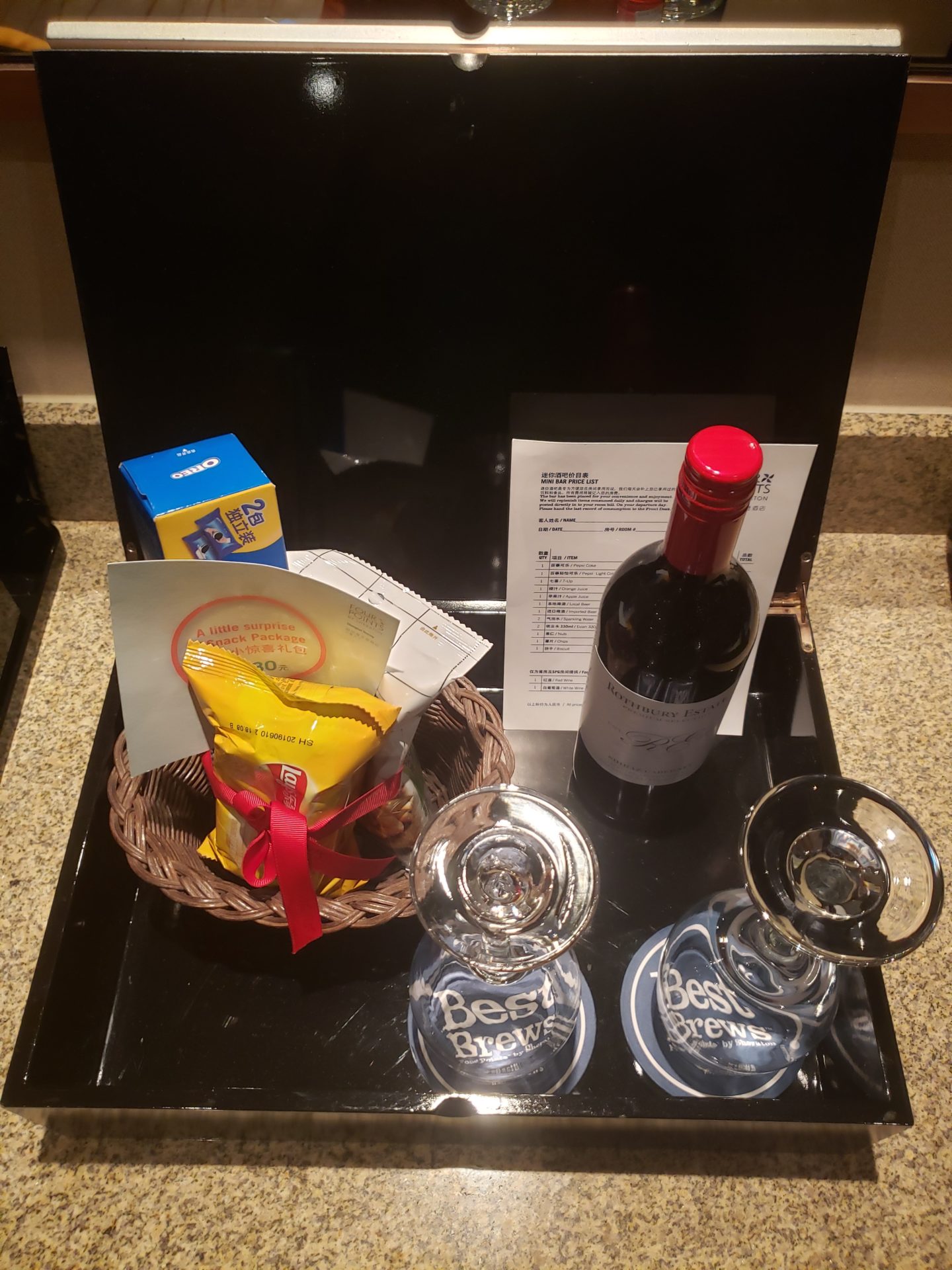 a basket of wine and wine glasses