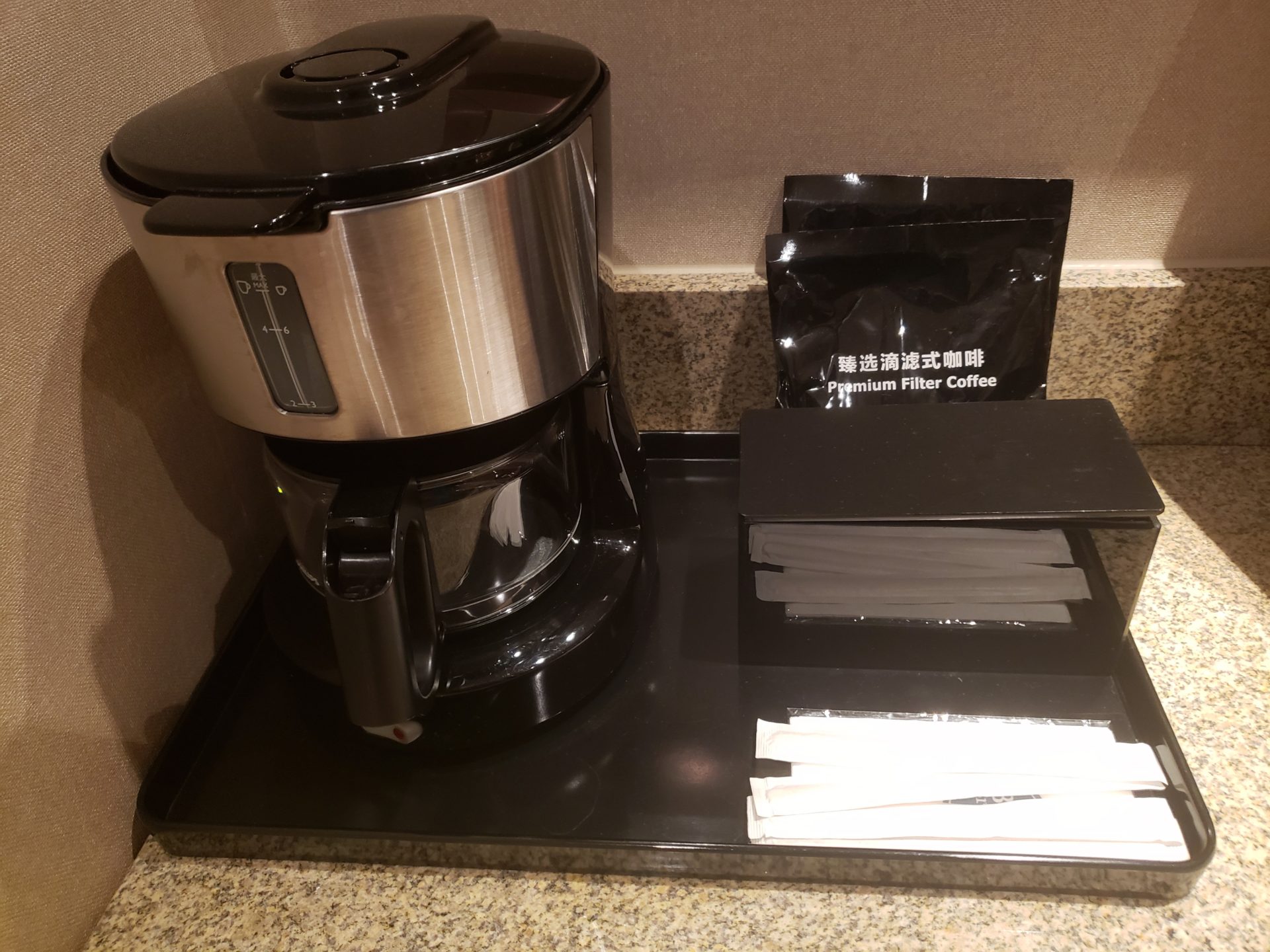 a coffee maker and some bags