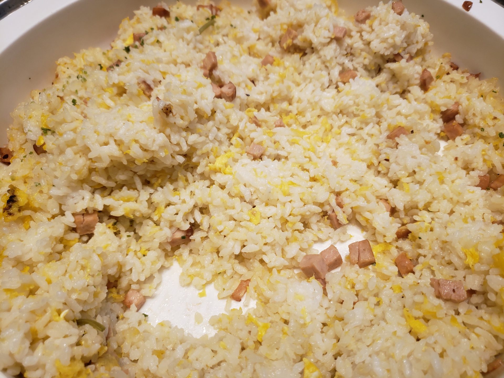 a bowl of rice with meat and eggs