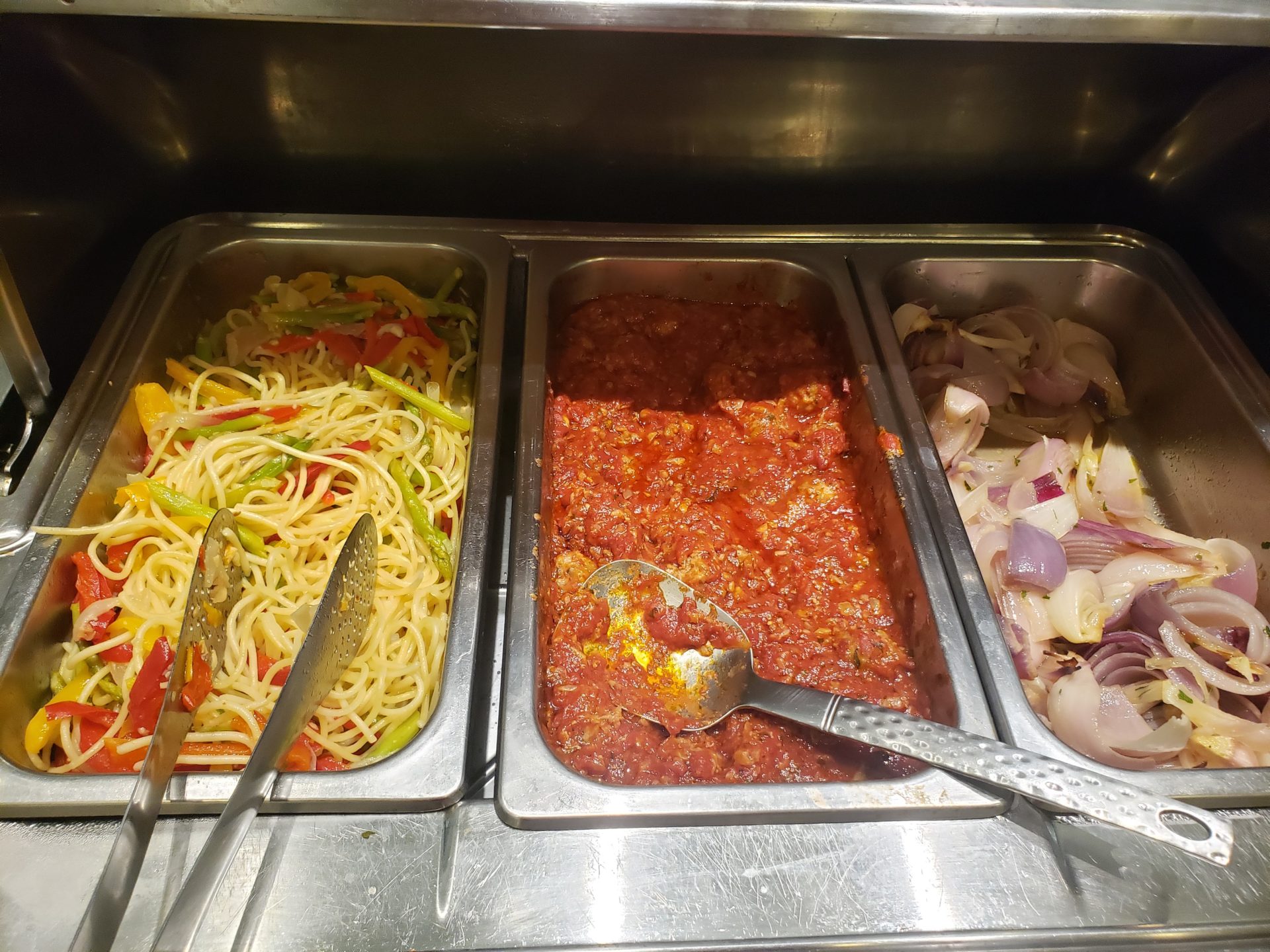 a buffet line with food in containers