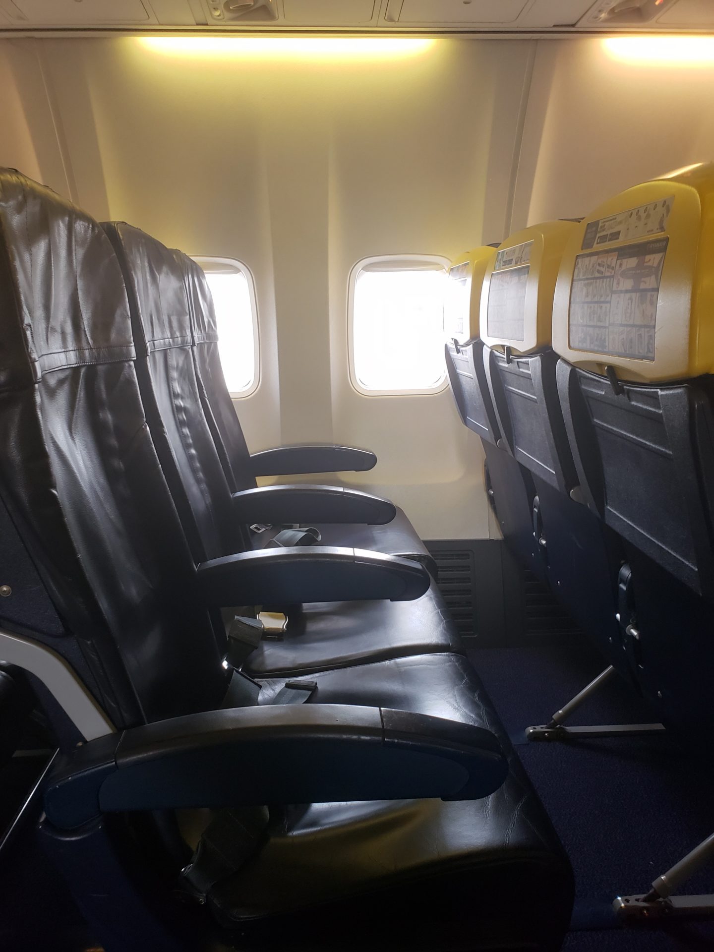 seats in an airplane with windows