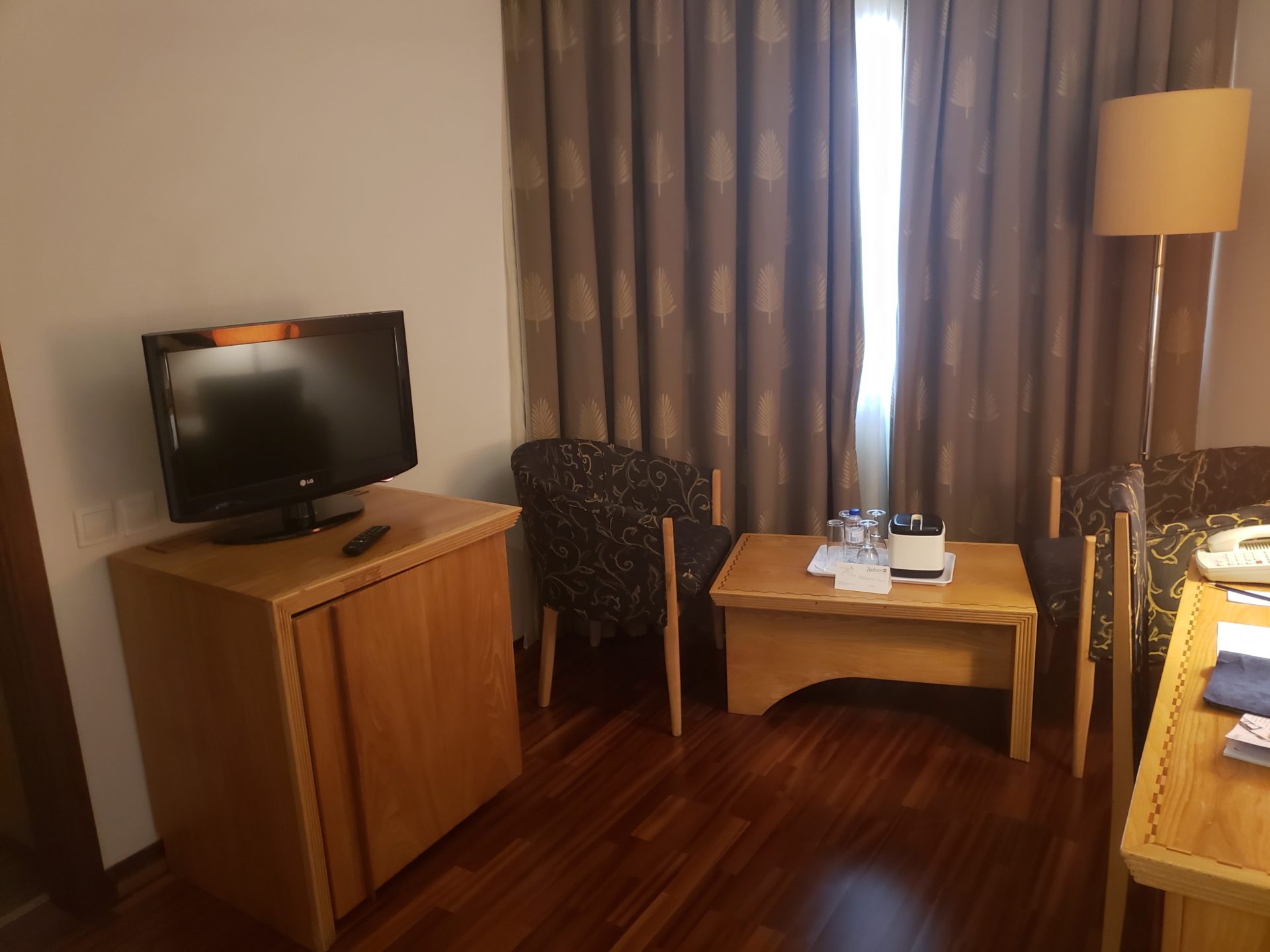 a room with a tv and a table