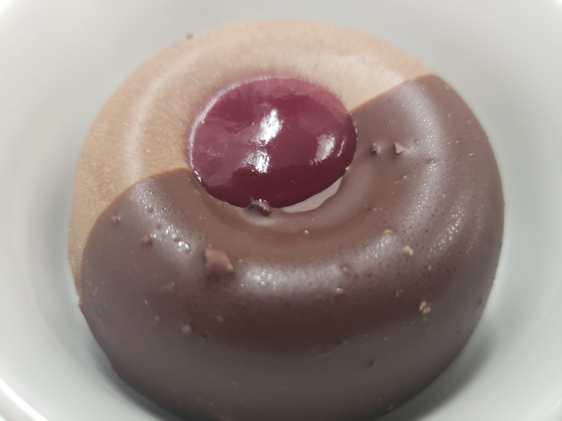 a chocolate and red donut