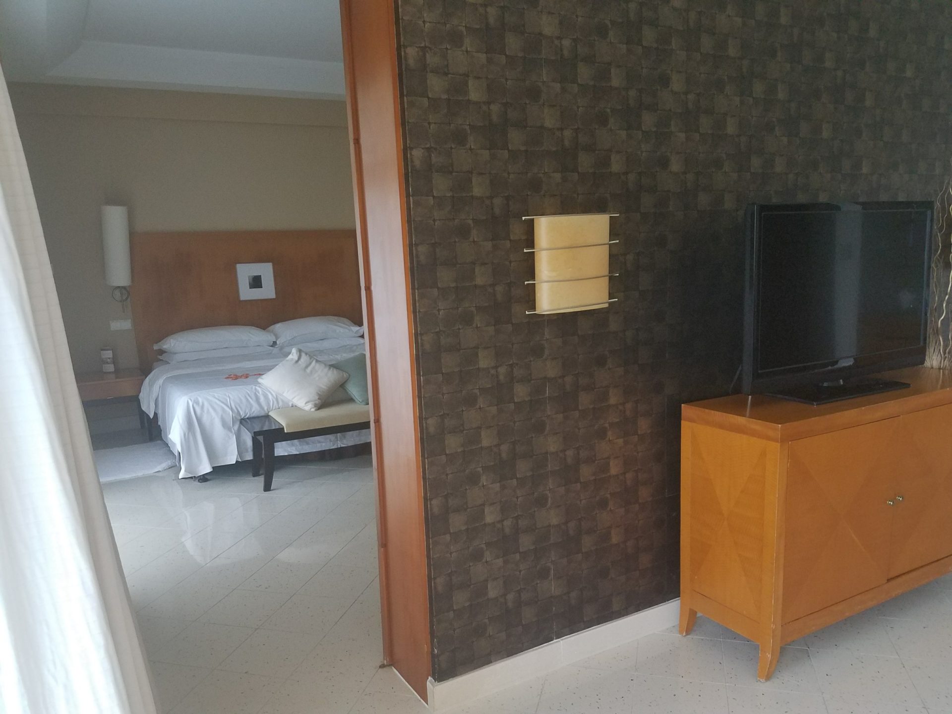 a room with a tv and a bed