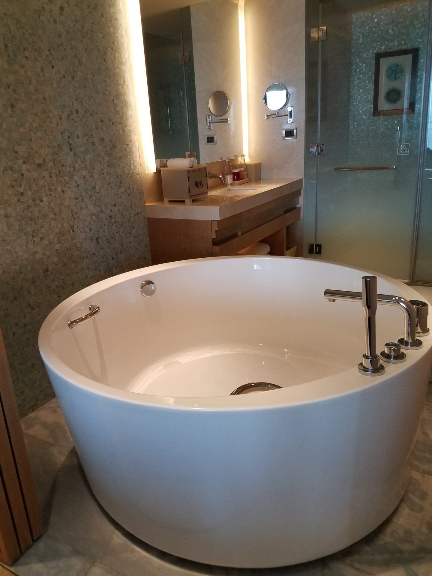 a large white tub in a bathroom