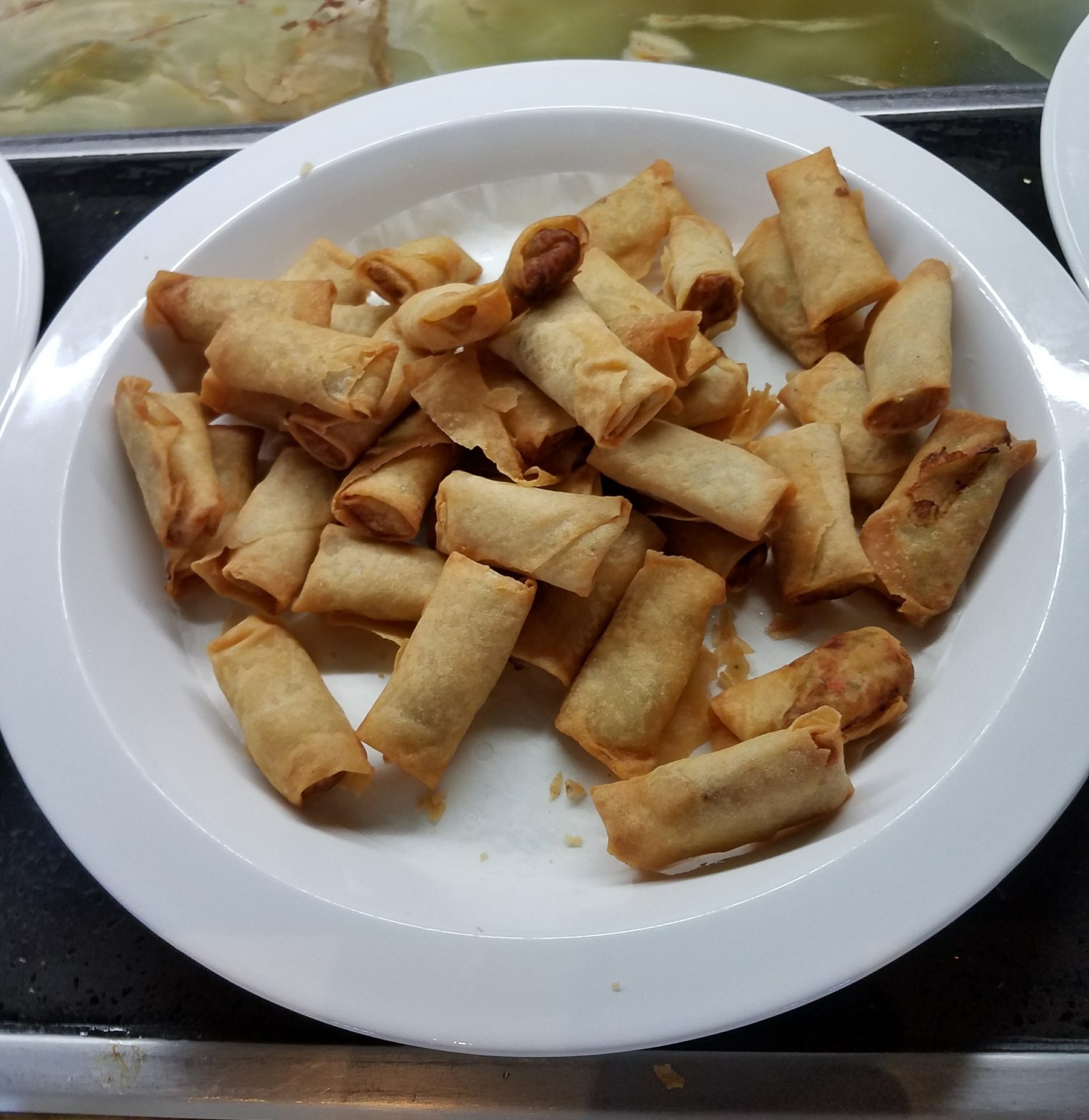 a plate of fried spring rolls