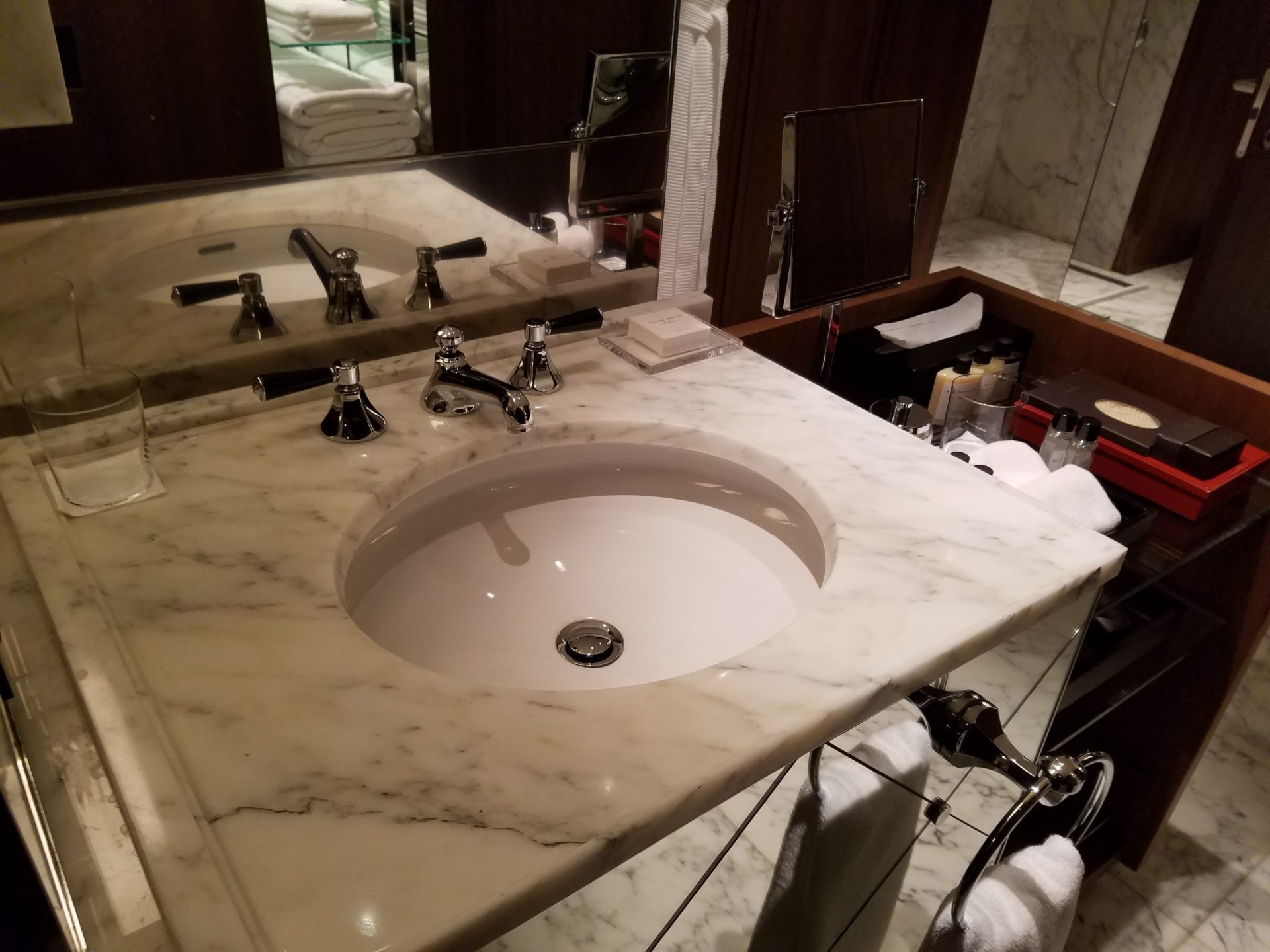 a bathroom sink with a mirror and a sink