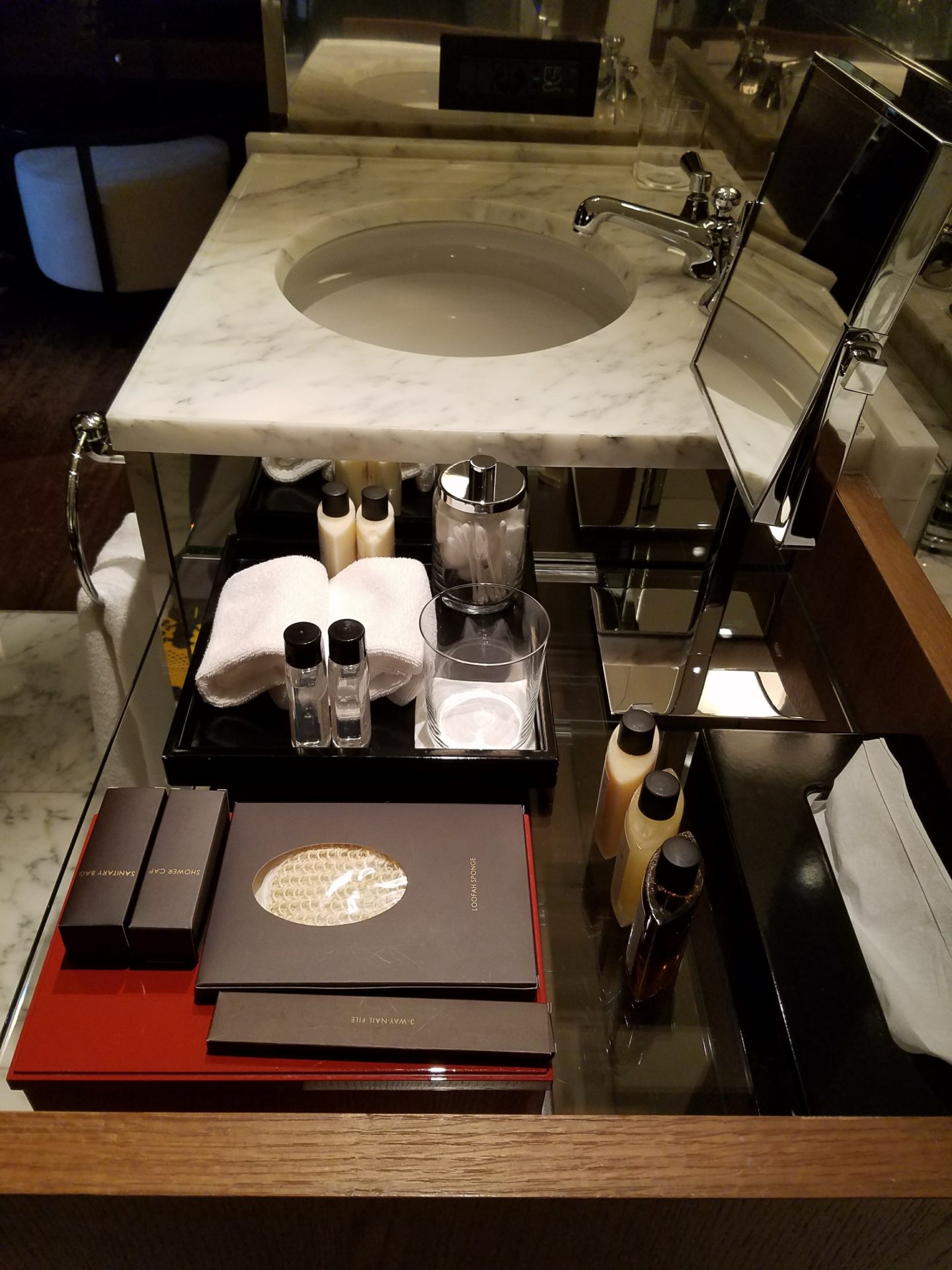 a bathroom sink with a mirror and a counter top