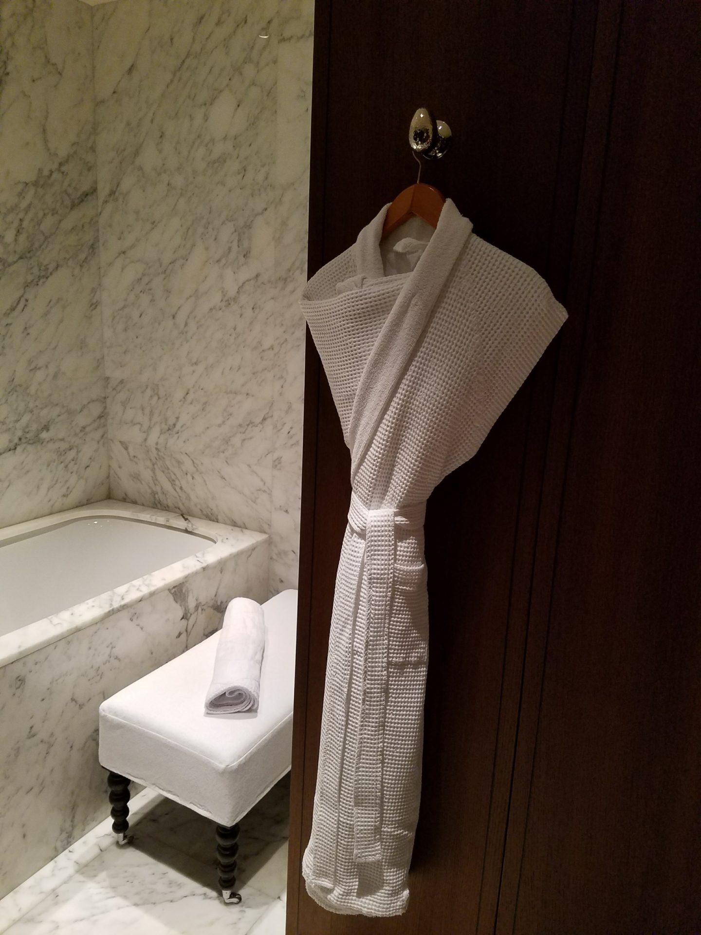 a white robe on a door