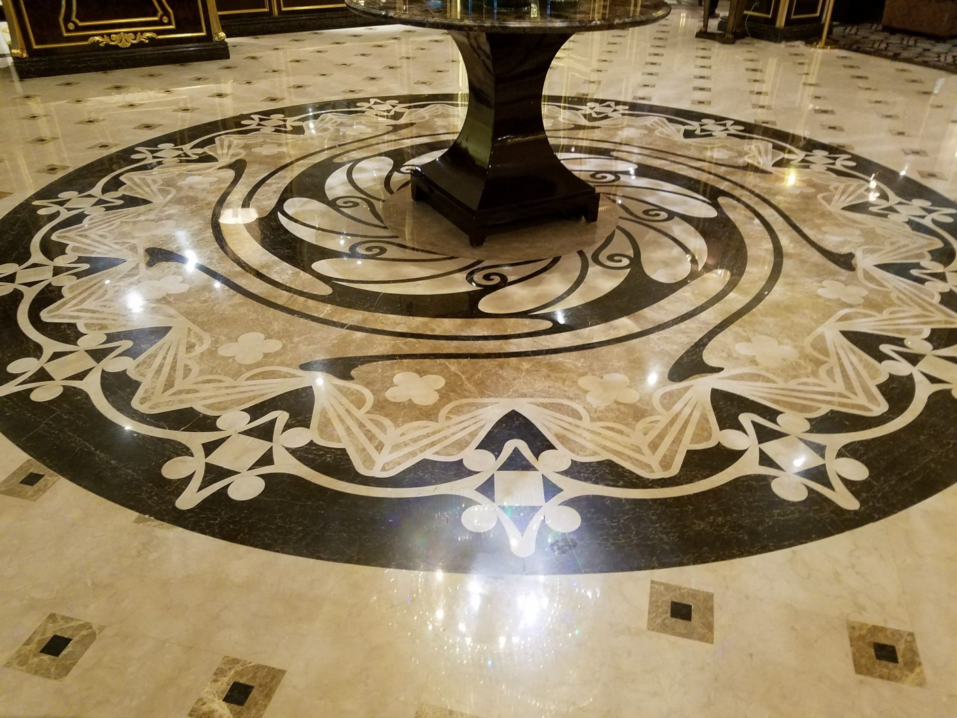 a circular table with a circular design on the floor
