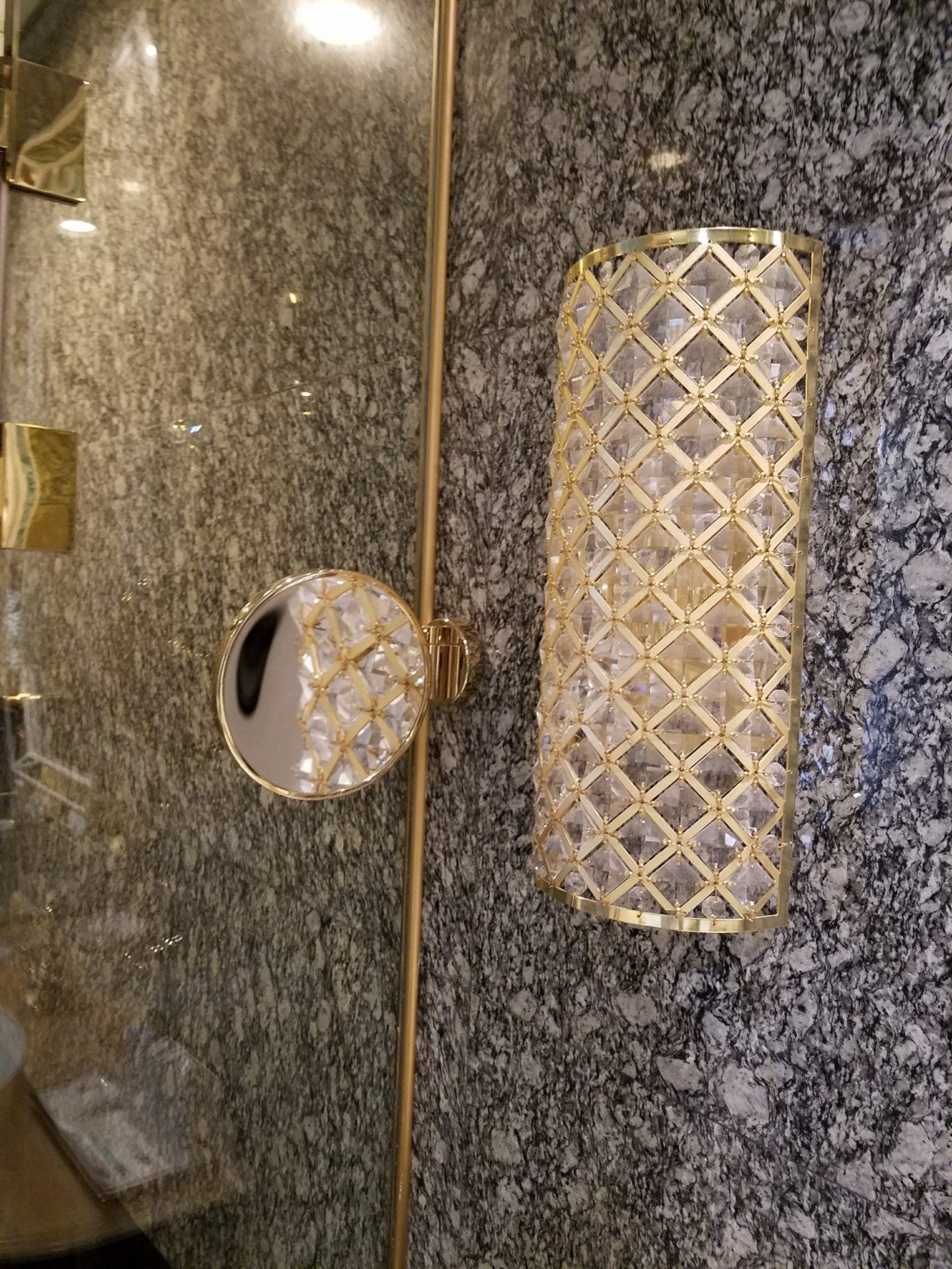 a gold and glass light fixture