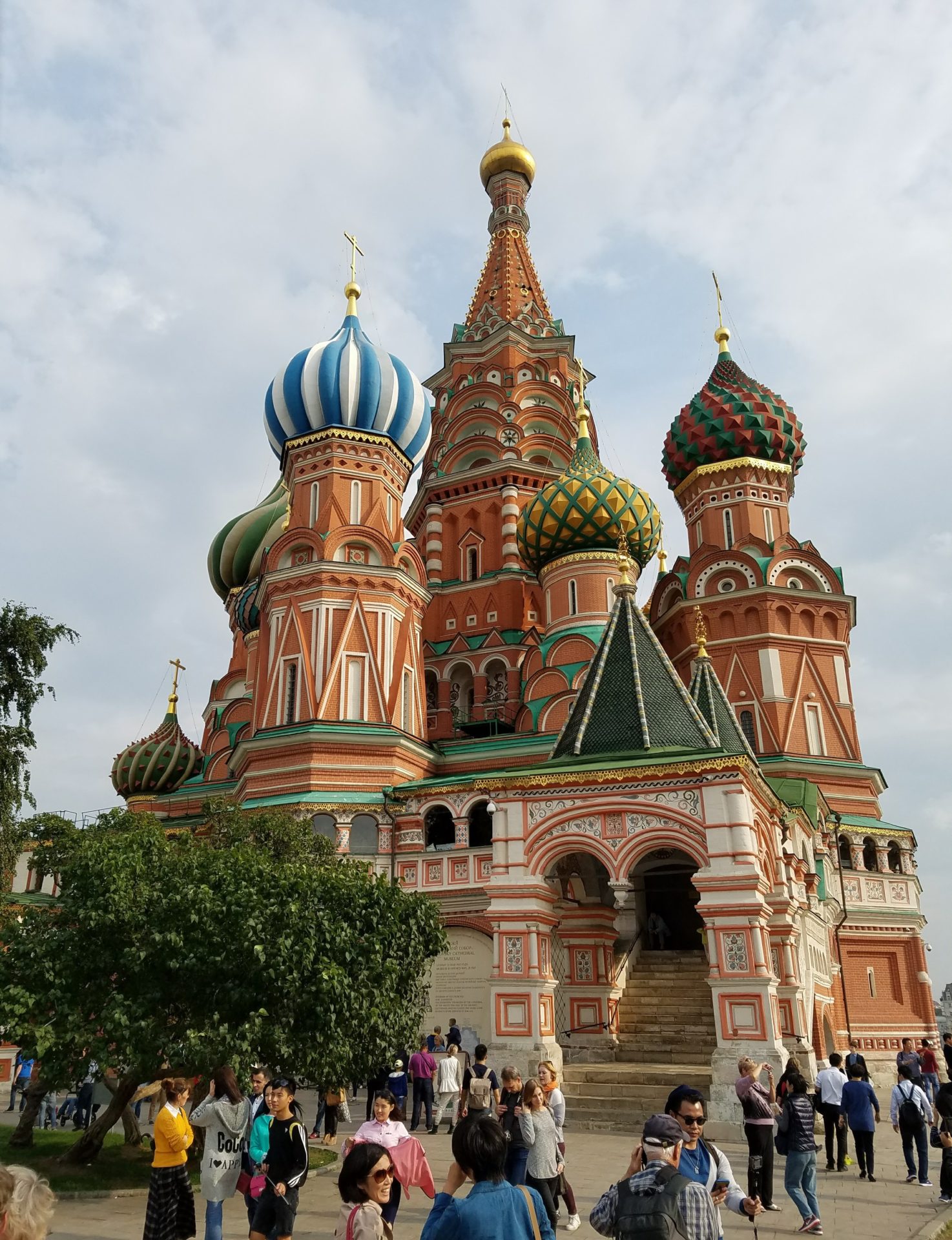 a large building with colorful domes with Saint Basil's Cathedral in the background