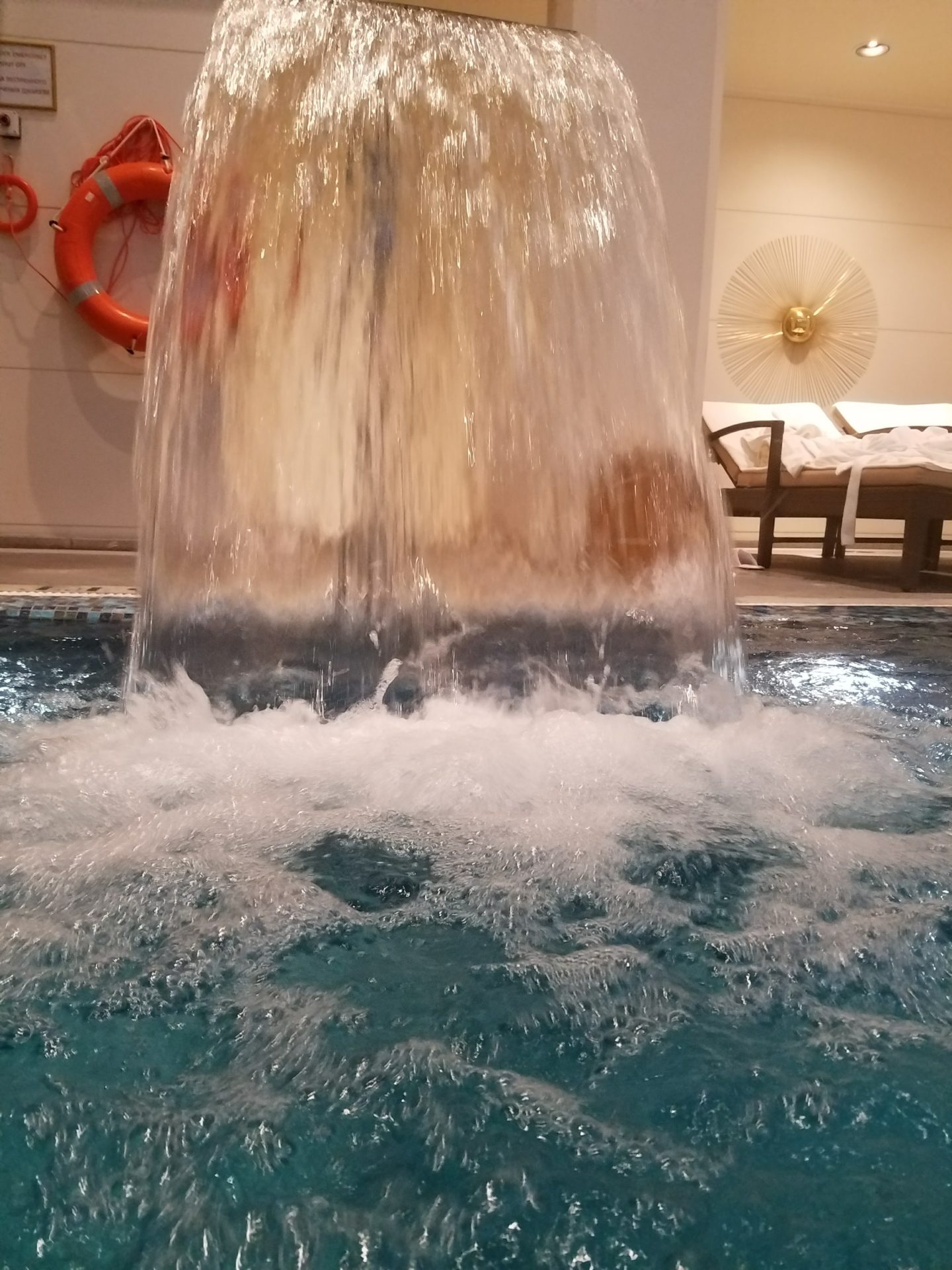 a water falling into a pool
