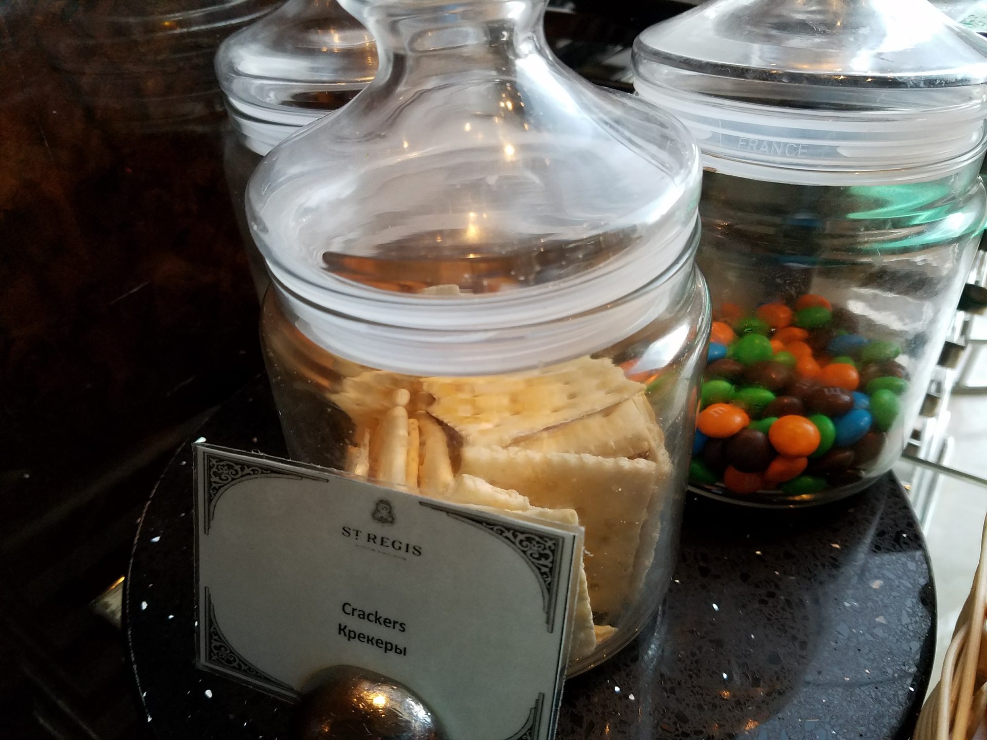 a group of jars with crackers and candy