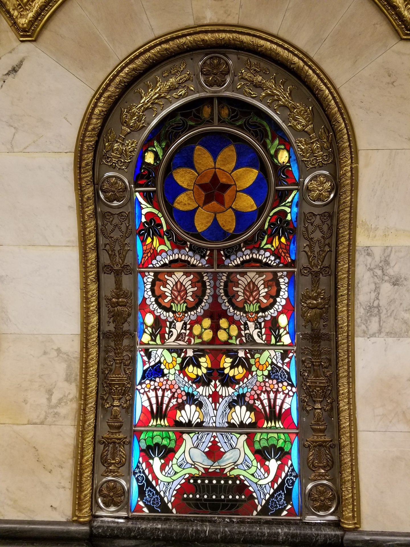 a stained glass window in a wall