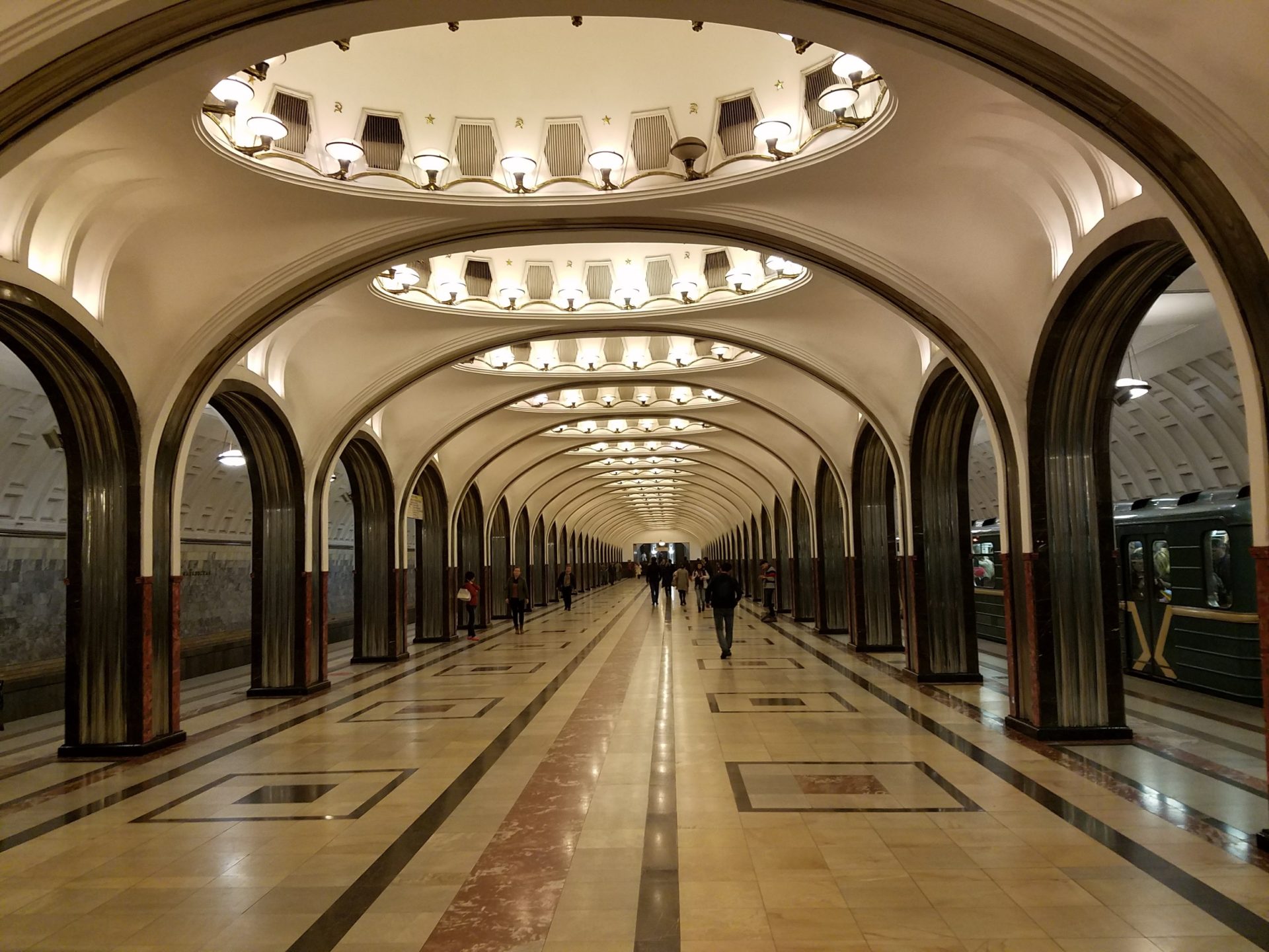 a hallway with many arches and lights