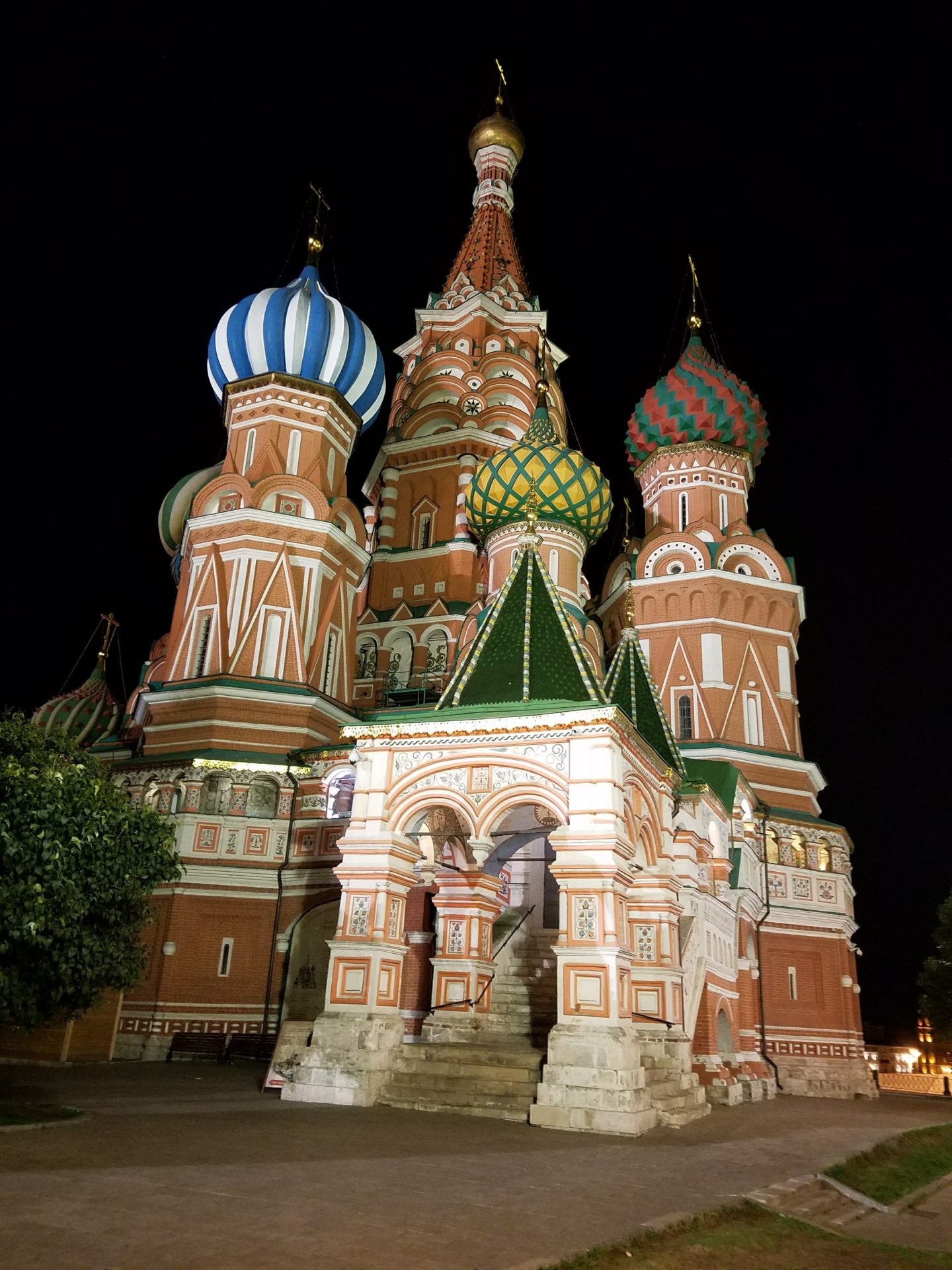 a building with colorful domes at night