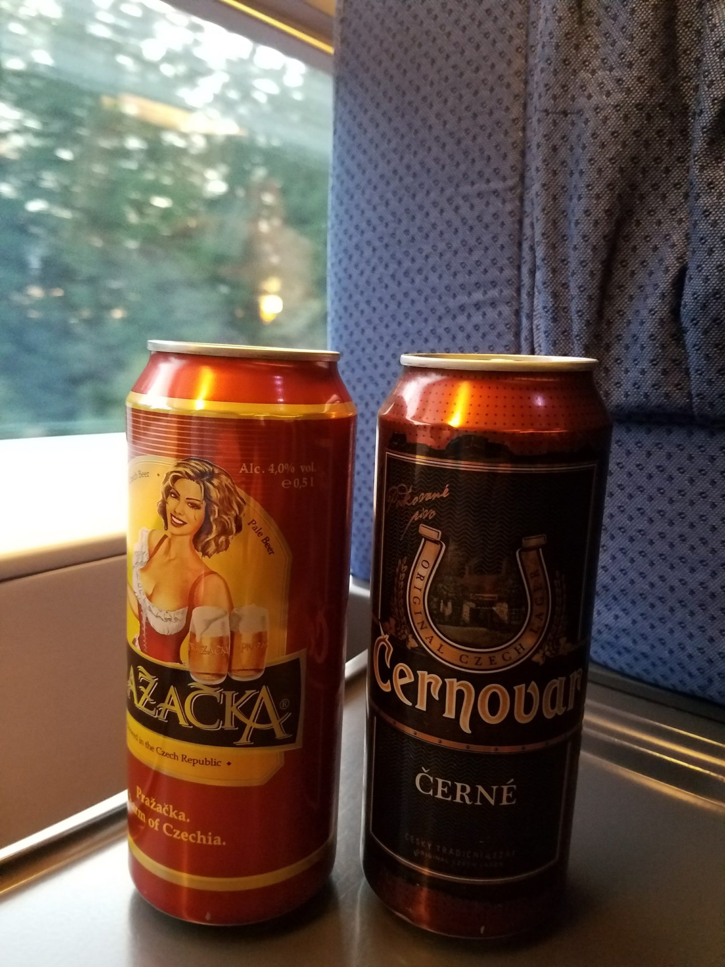 two cans of beer next to each other