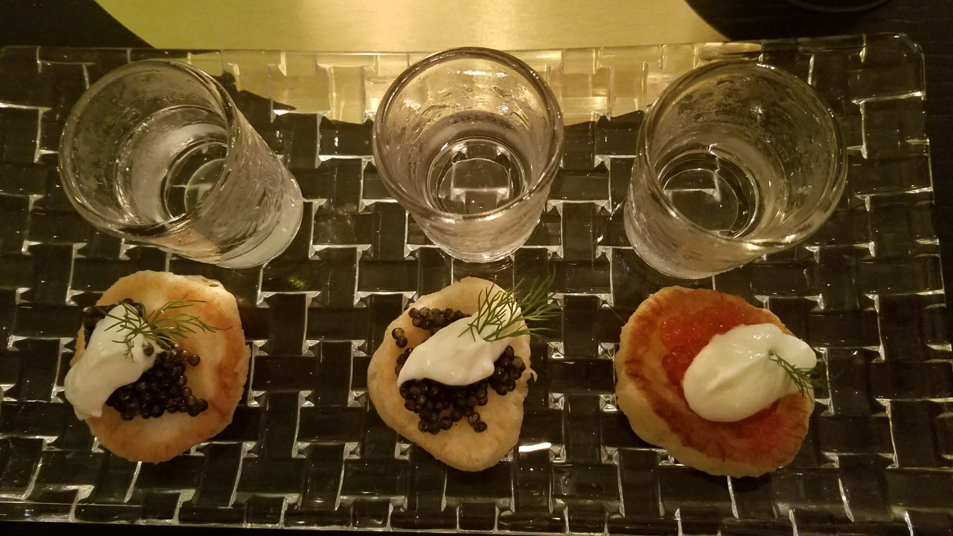 a tray of food and glasses