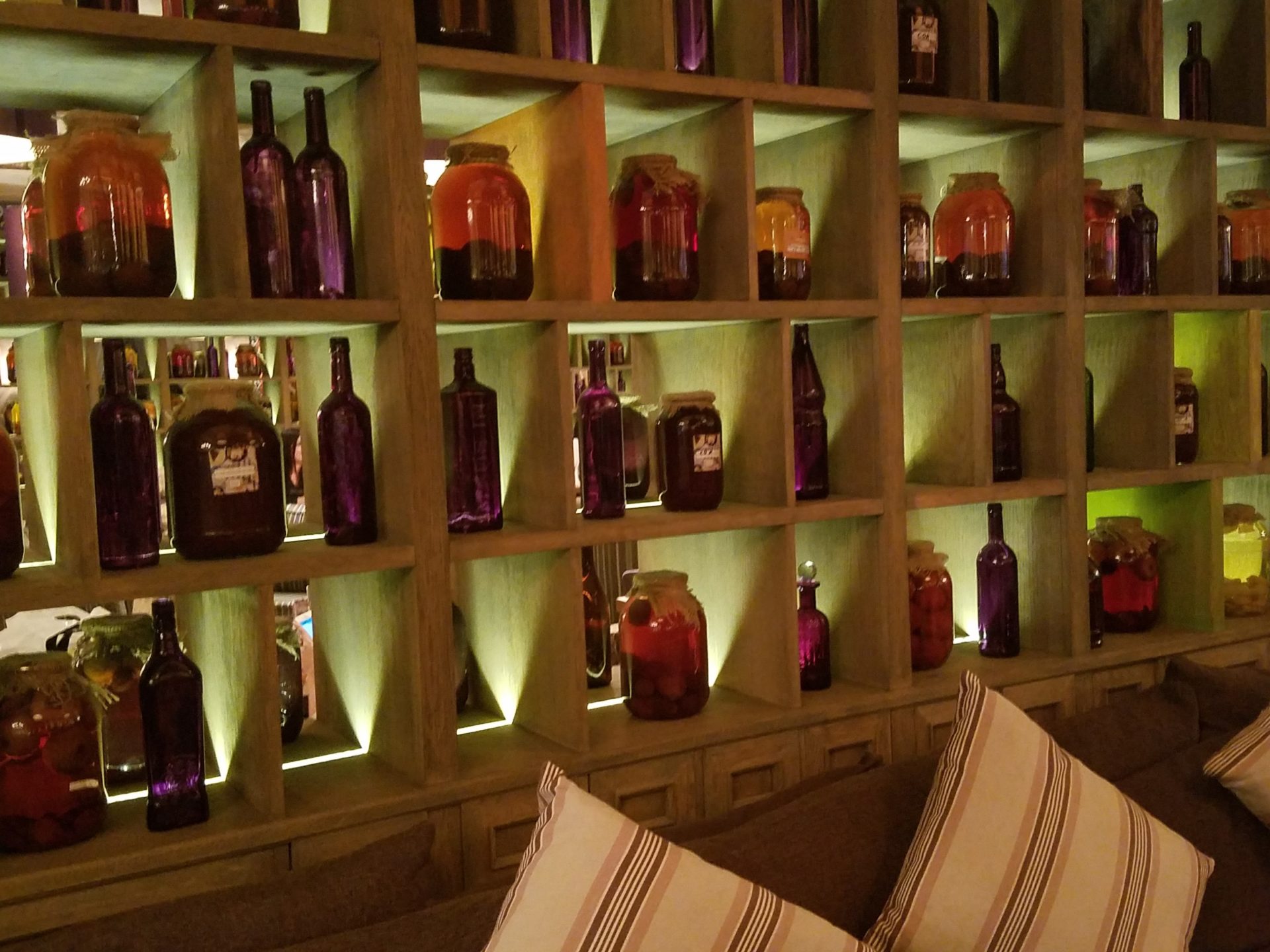 a shelf with bottles and jars on it