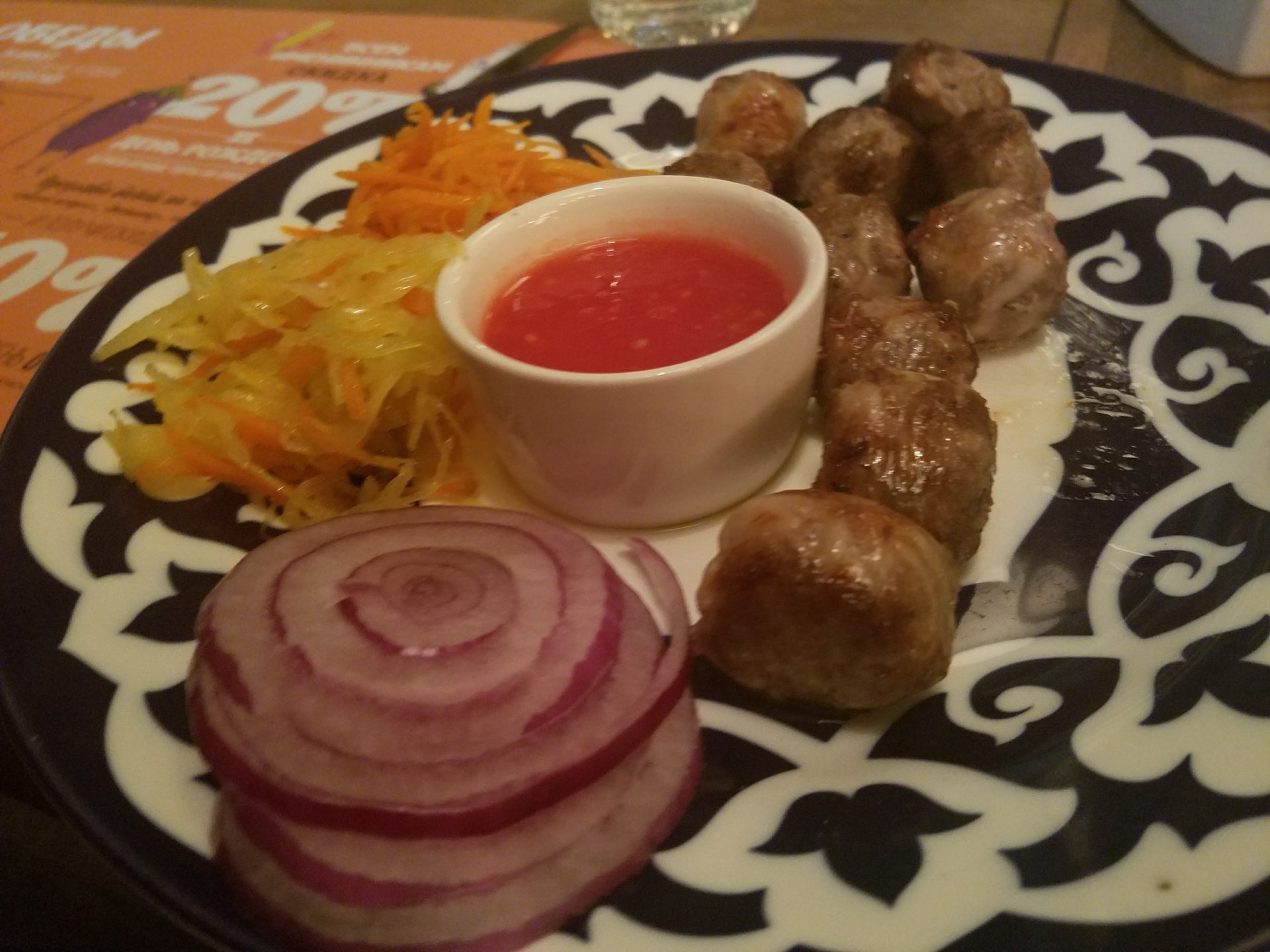 a plate of meatballs and vegetables