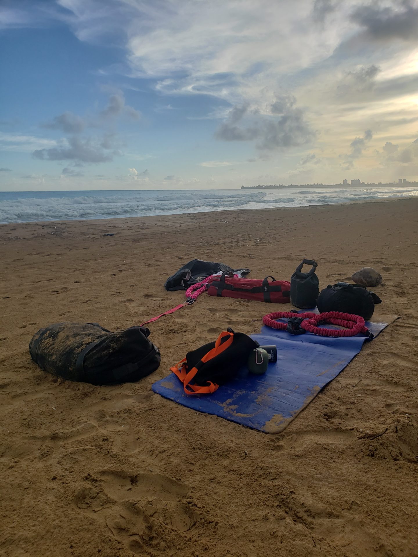 a group of bags on a beach