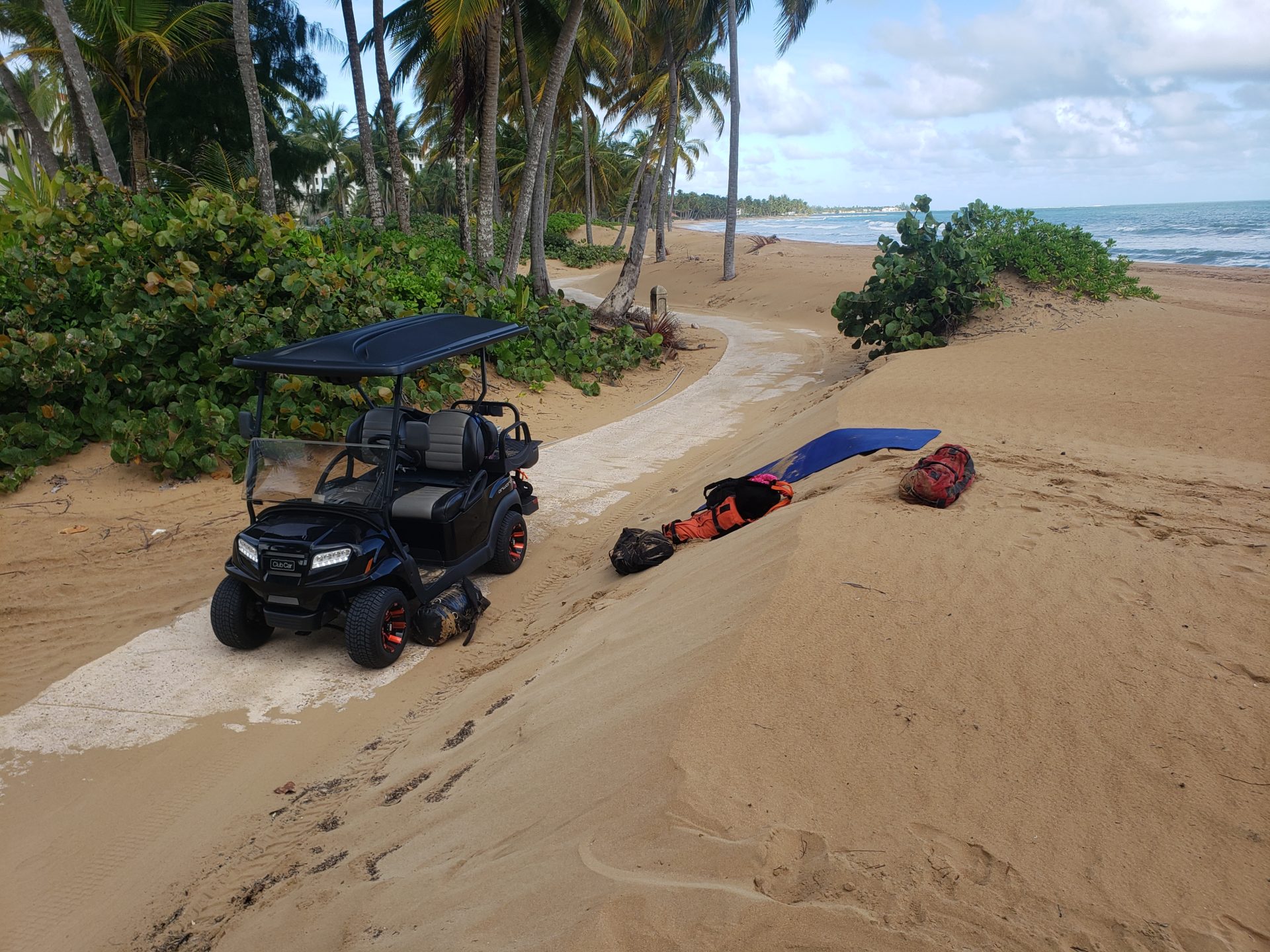 a golf cart parked on a beach