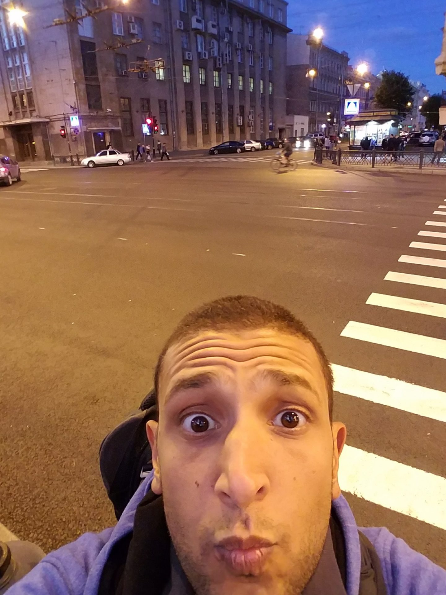 a man taking a selfie in a city