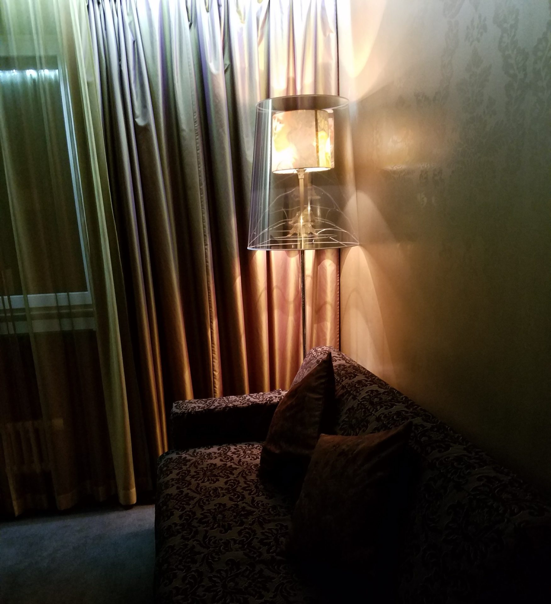 a lamp next to a couch