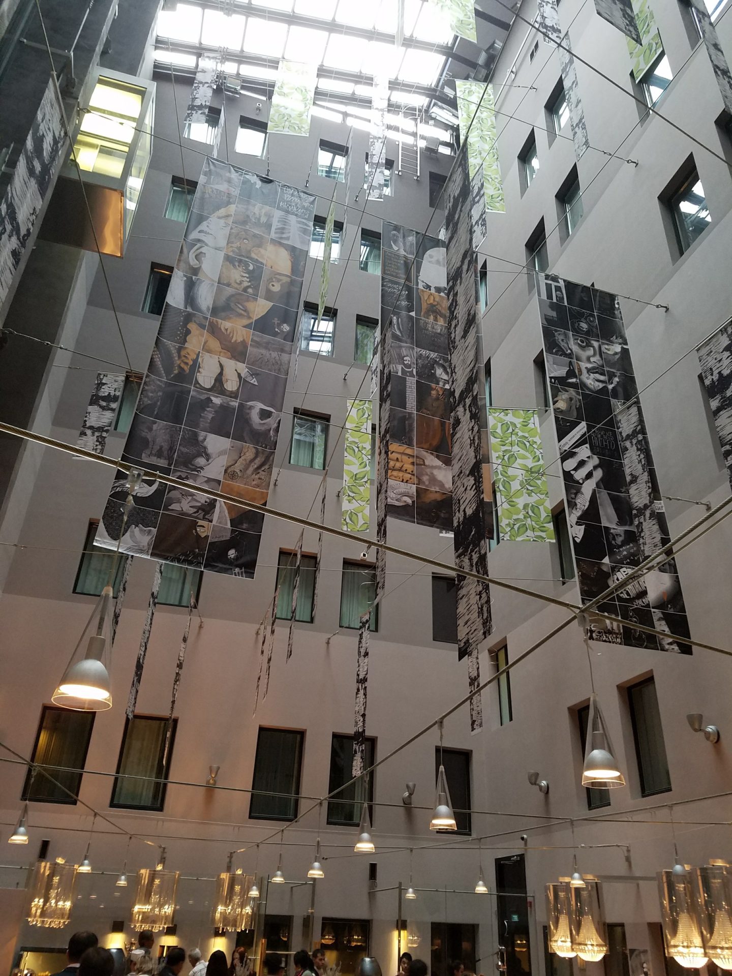 a building with many banners from the ceiling